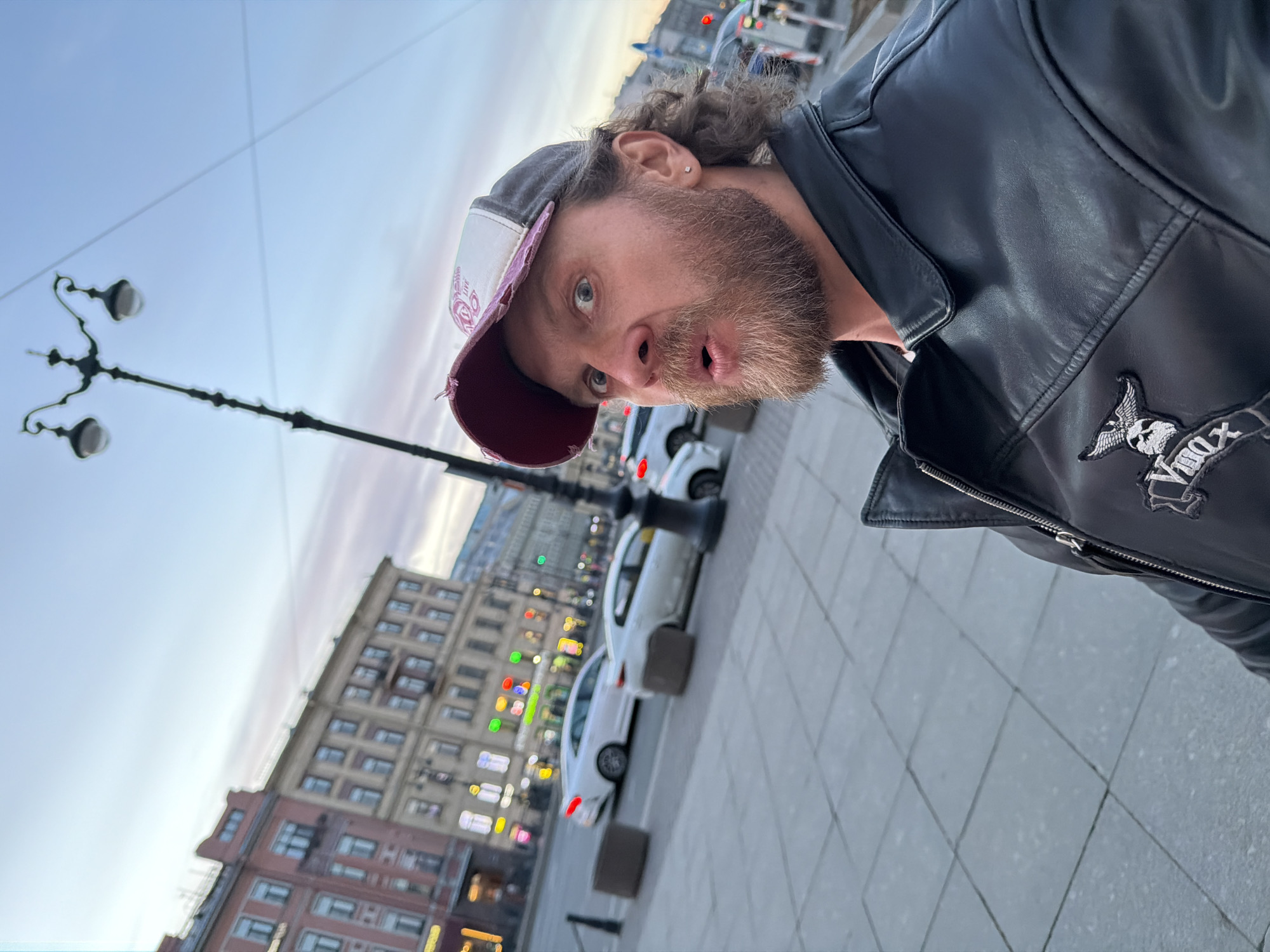 Man in skull-patched leather jacket photographed in Saint Petersburg