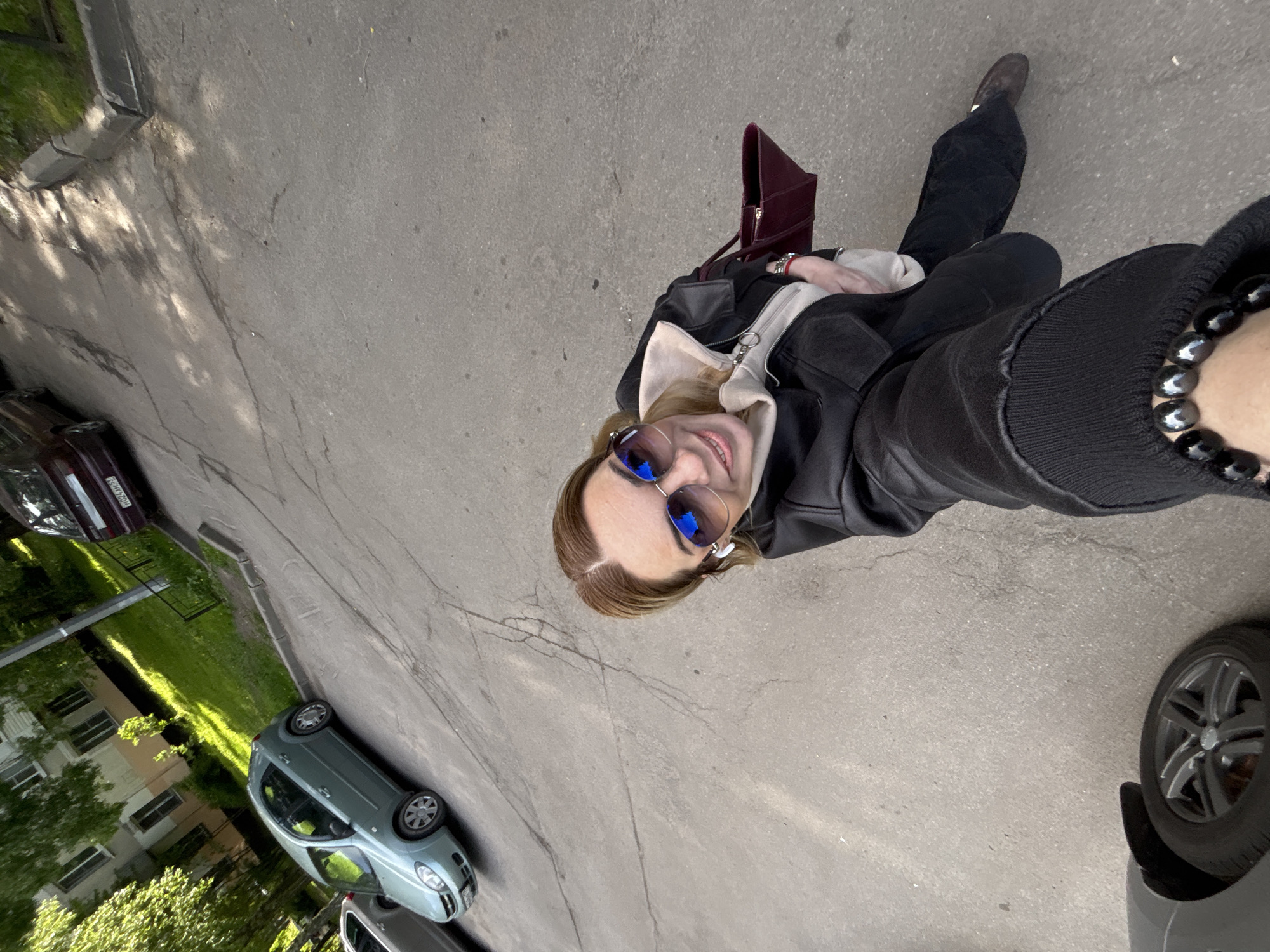 Woman photographs herself around Saint Petersburg parks and streets
