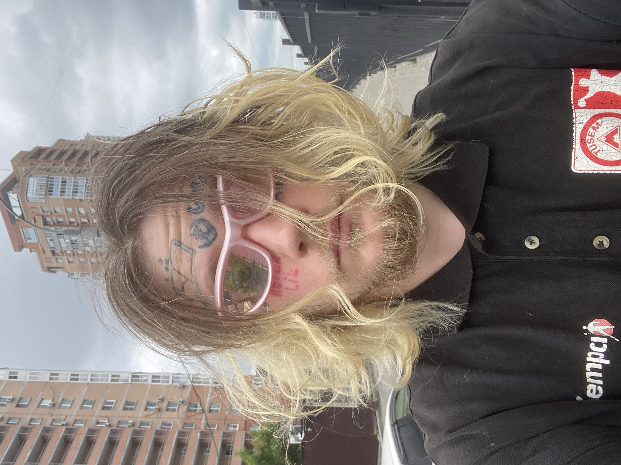 Selfie series in Khabarovsk: facial tattoos, pink shades, messy blonde hair