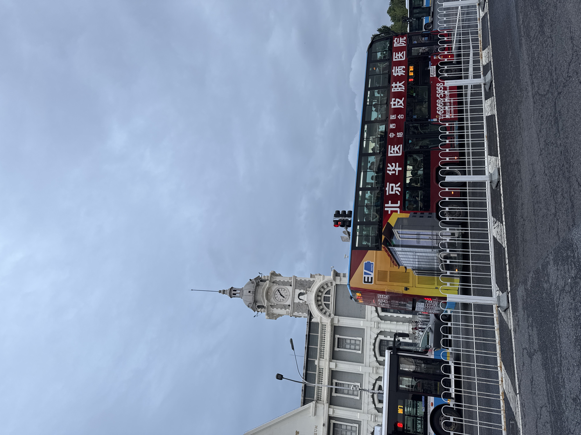 Tour bus spotted on Dongcheng District street near clock tower