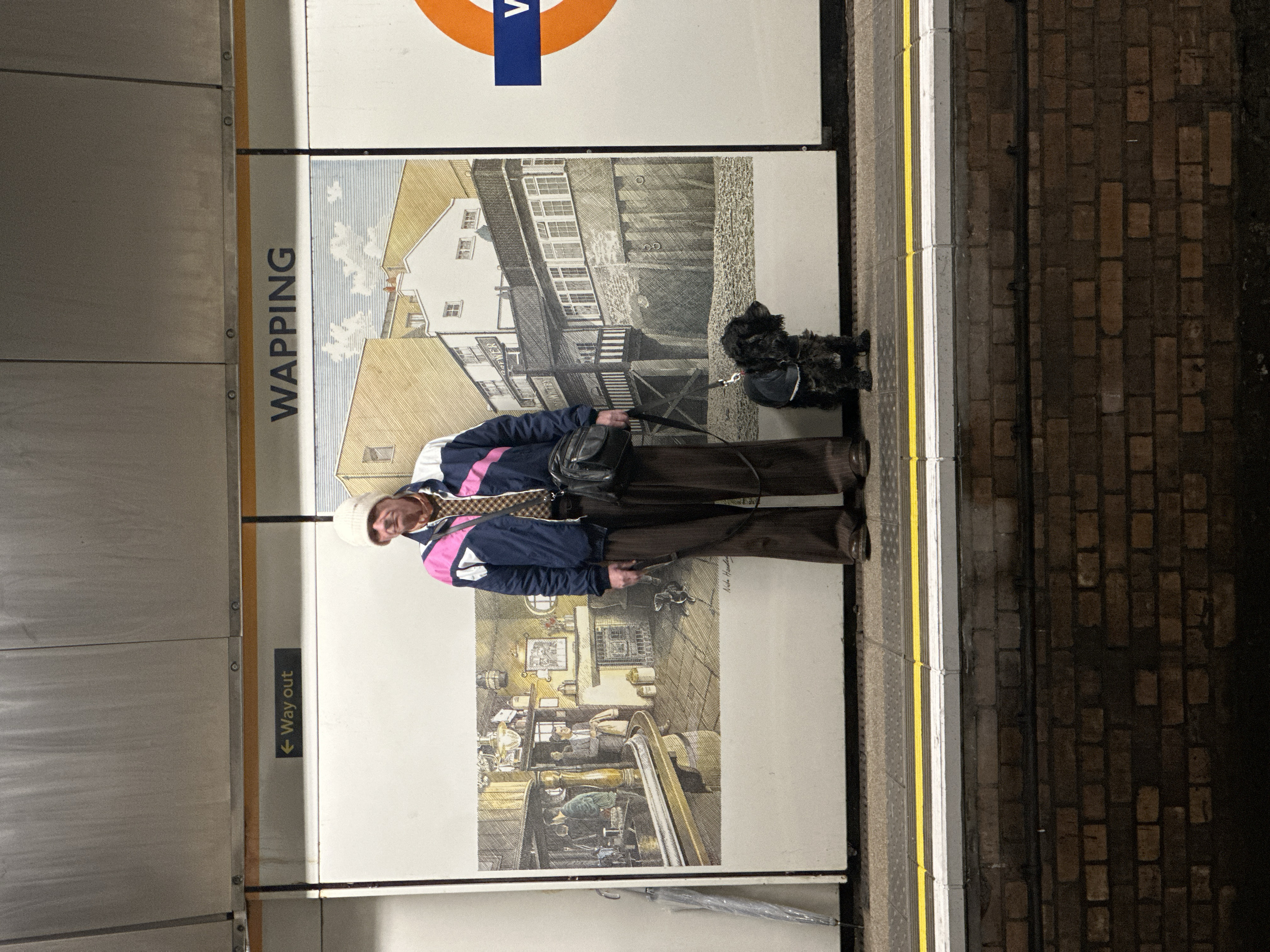 Person with small dog spotted at Wapping Underground station