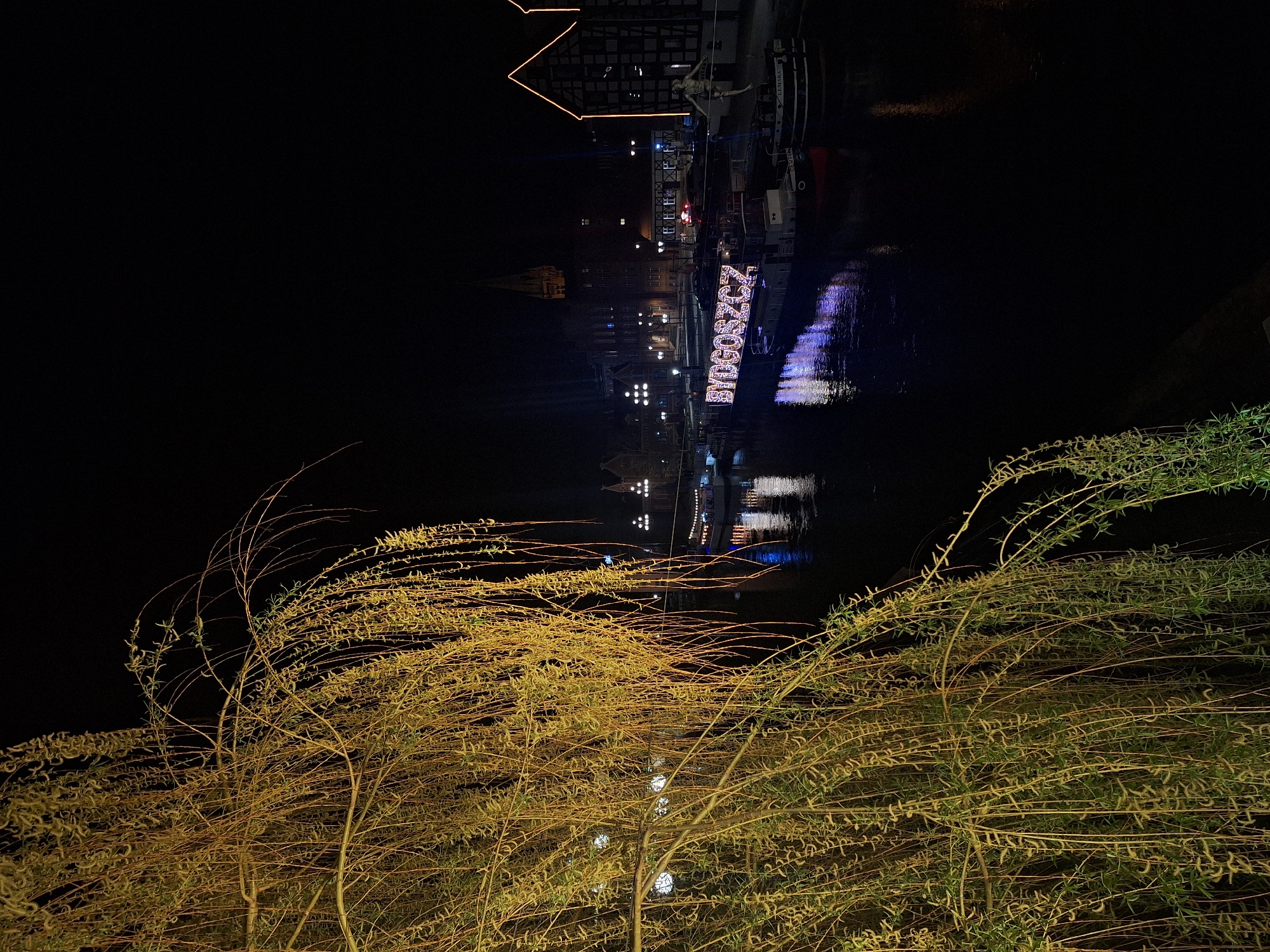Bydgoszcz riverside displays illuminated city name at night
