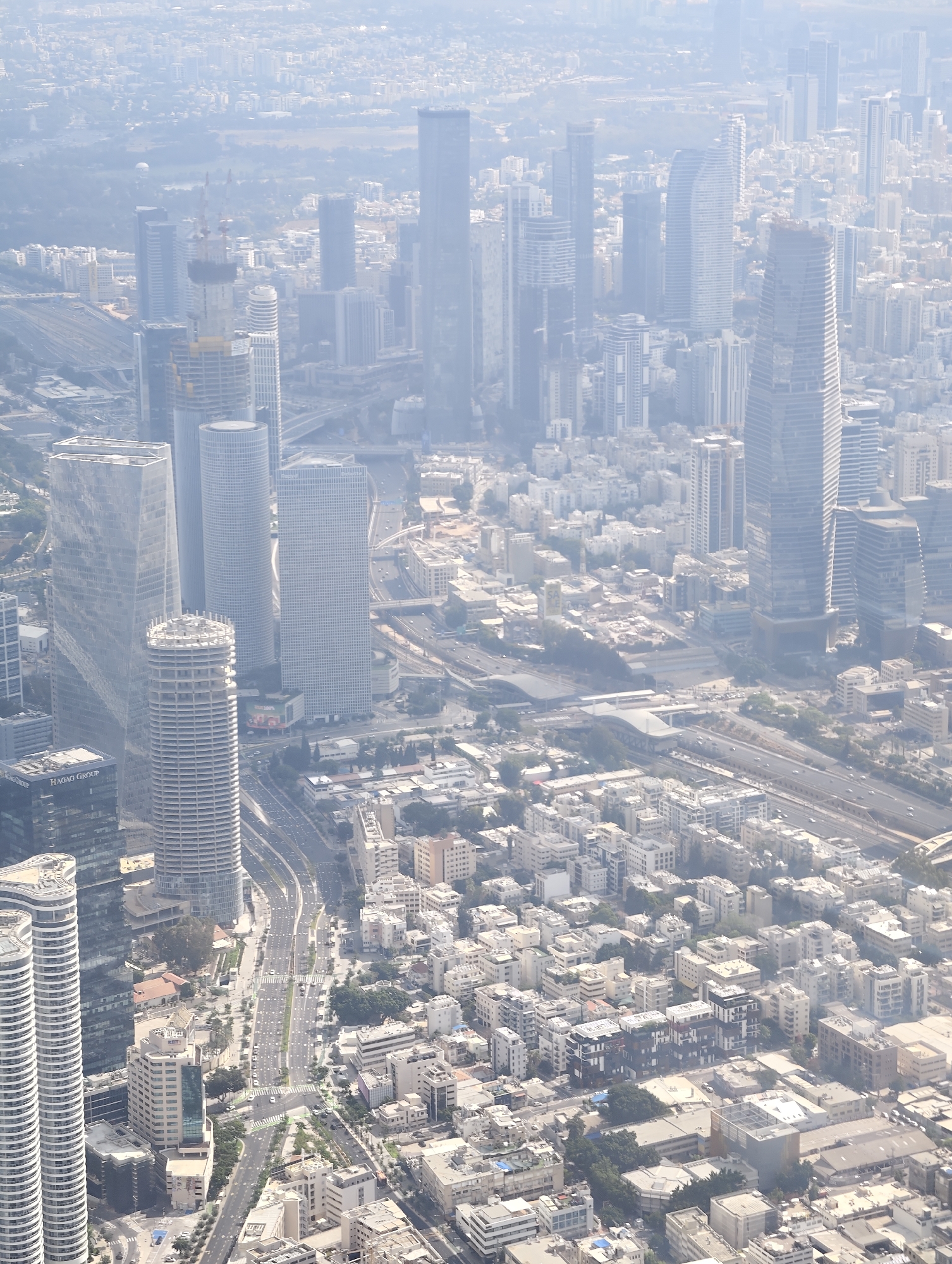 Tel Aviv's skyline mid-growth, towers and cranes across the city