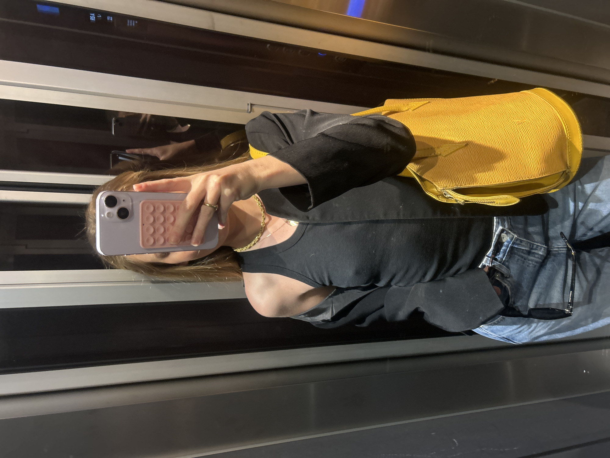 Urban scenes documented: elevator selfie, architecture, cityscape views