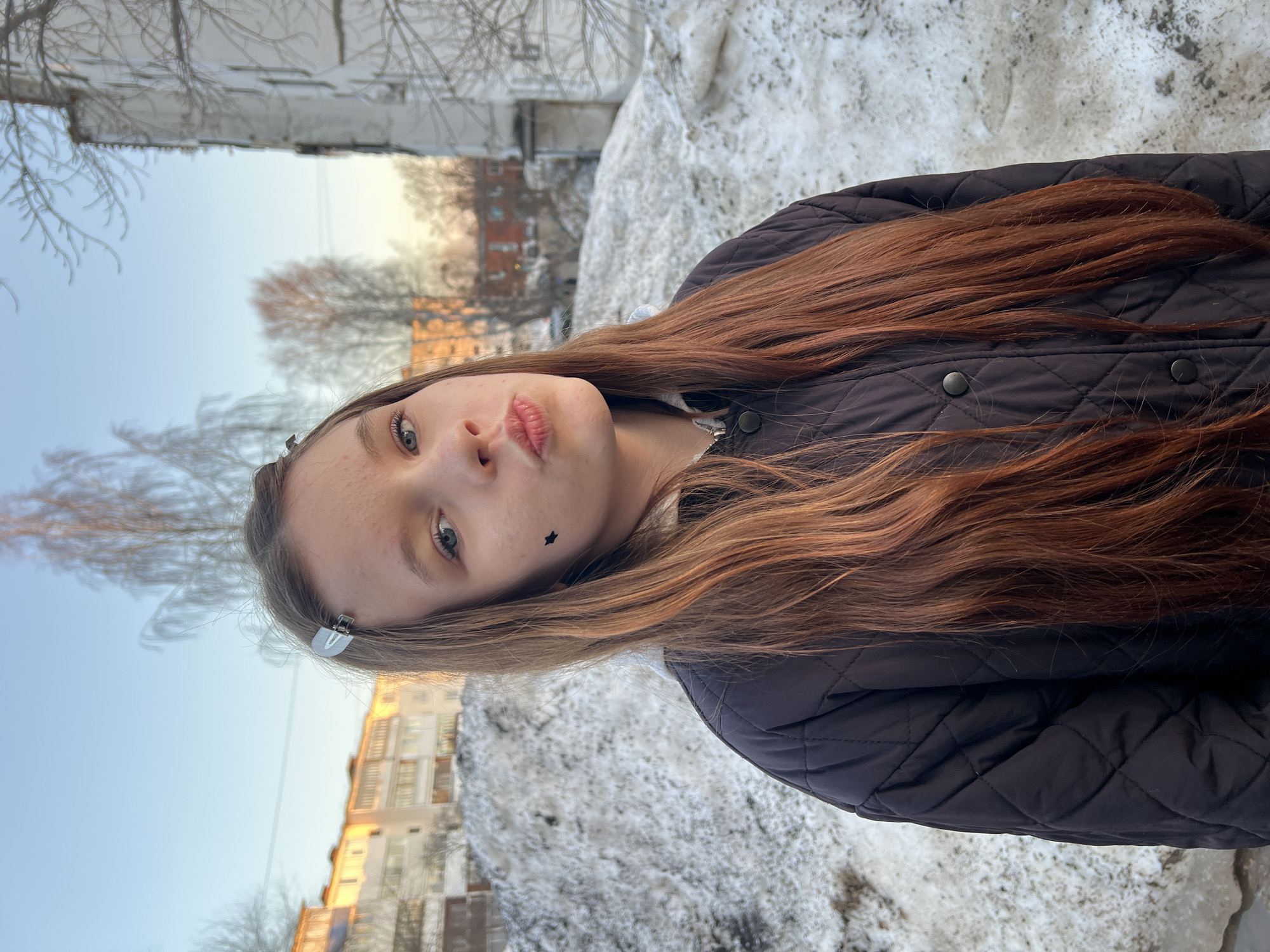 Children playing outdoors in snowy Noviy Urengoy residential area