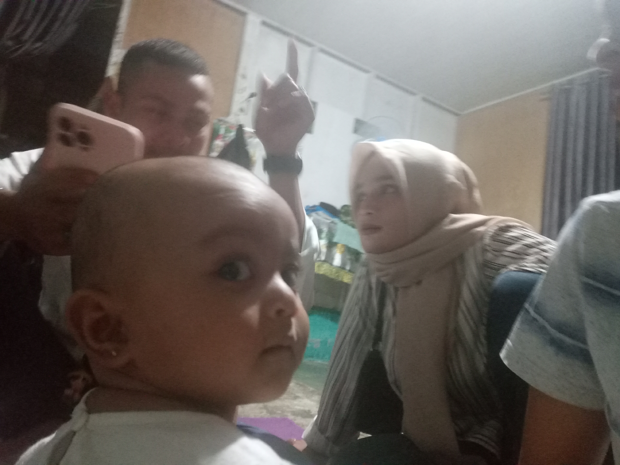 Family gathering revolves around a baby at home