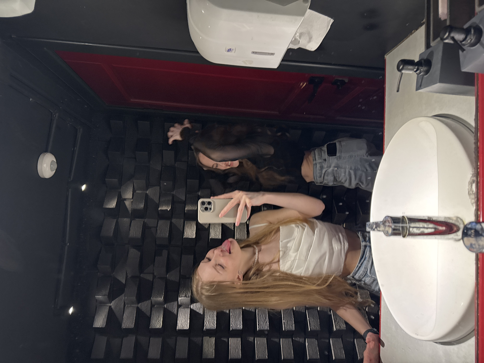 Mirror selfies at a Perm venue, June 2026