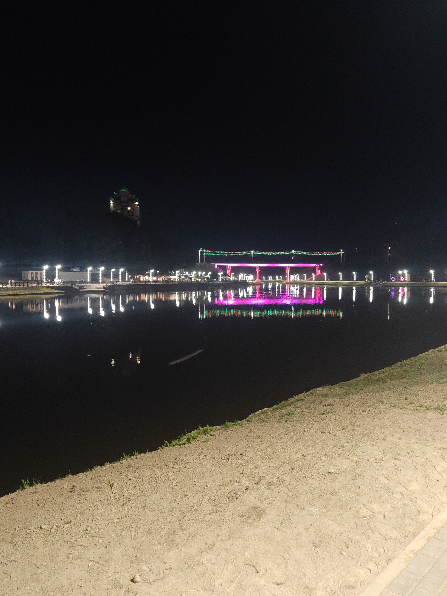 Nighttime river reflections along the Mahilyow waterfront