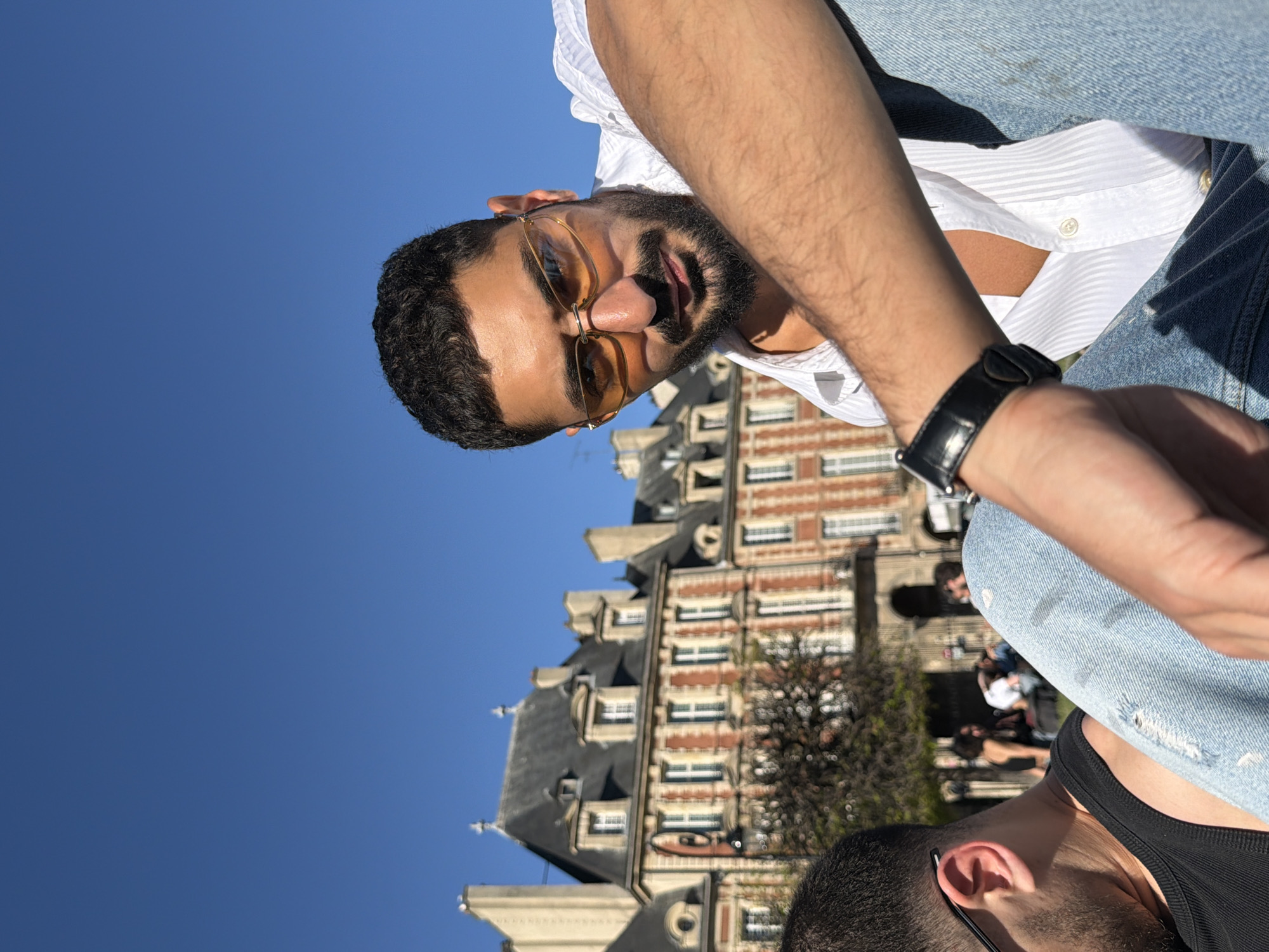 Bearded man spotted outdoors in Paris on sunny afternoon