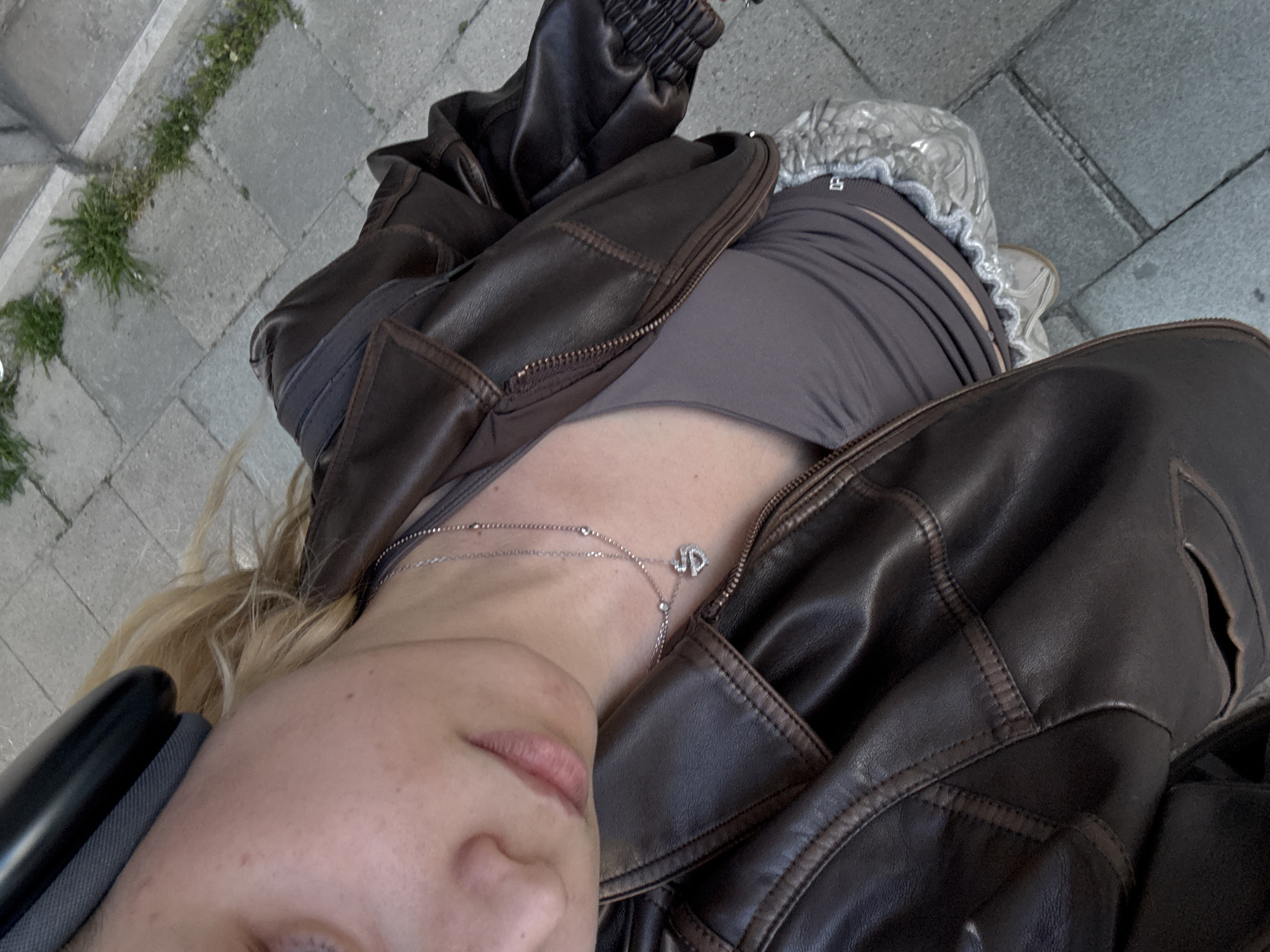Person photographs self and cityscape in sunny Mechelen