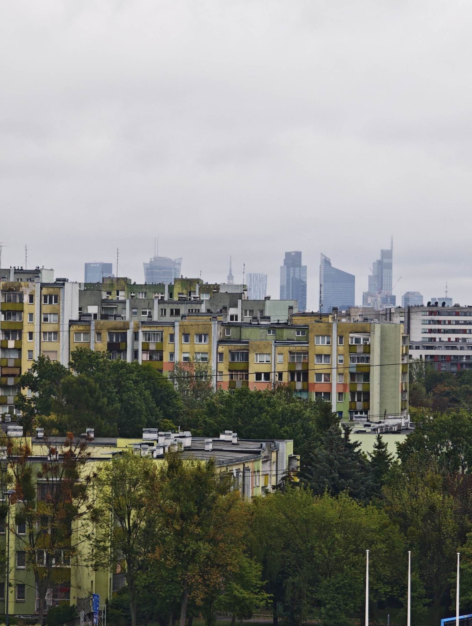 Cloudy day over a muted urban apartment skyline