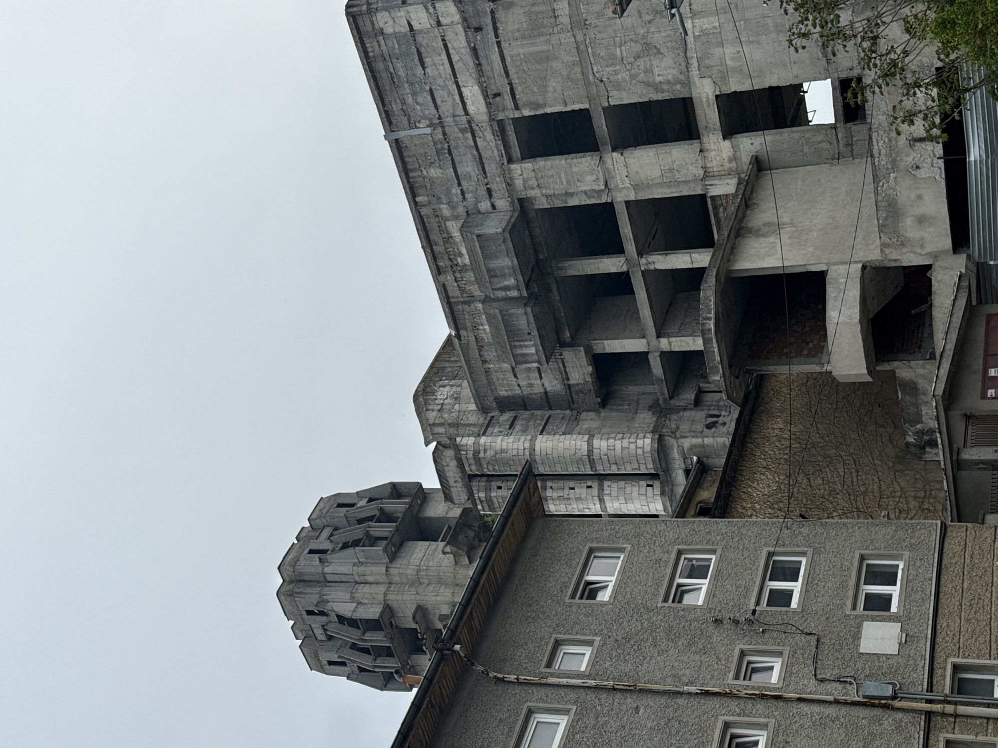 Man drinks energy drink while walking through Shumen, Bulgaria