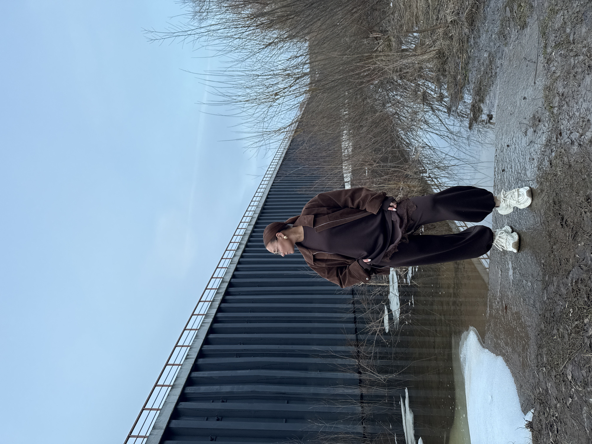 Woman spotted by water near structure in Chaikovsky, Russia