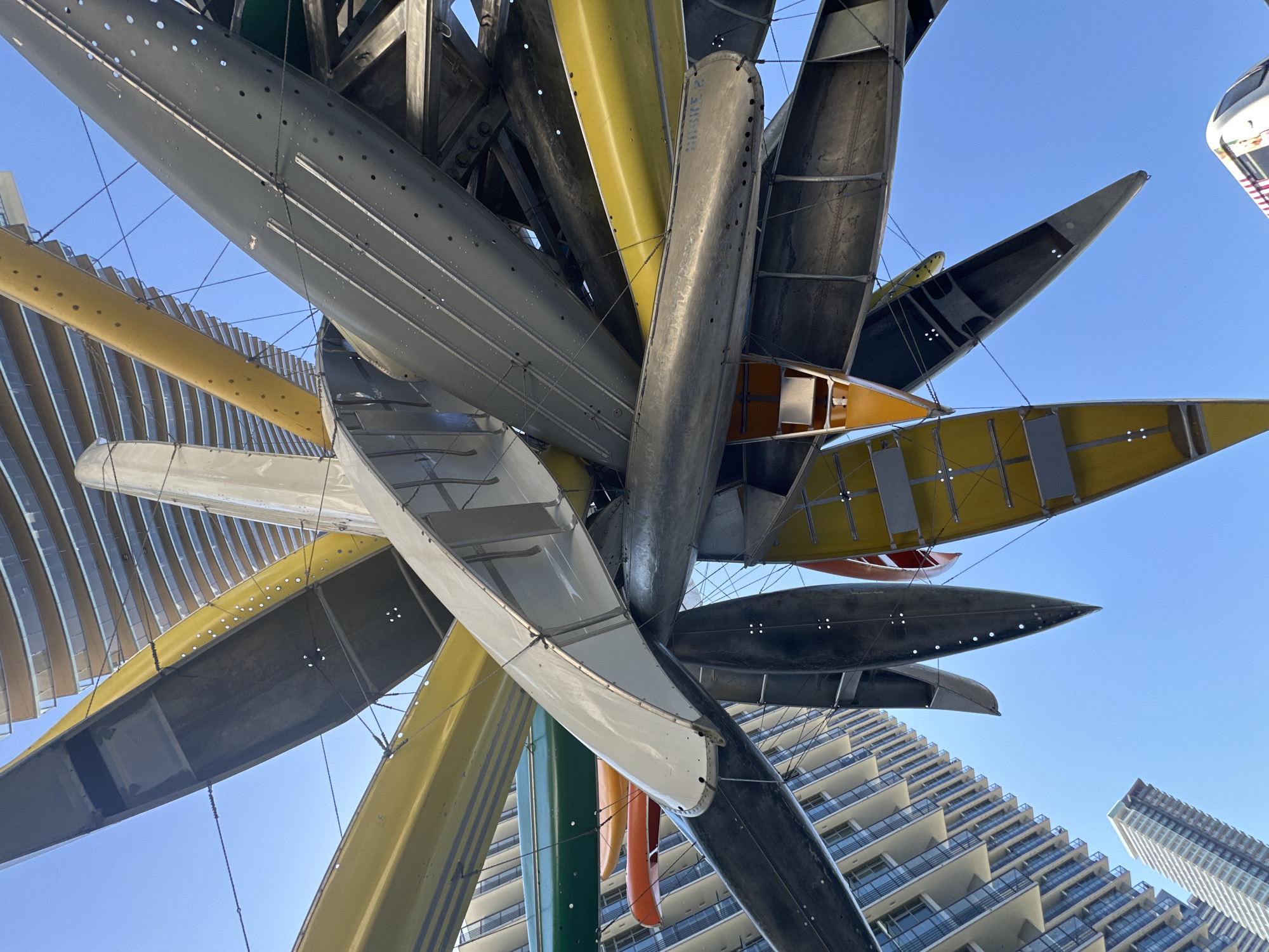 Burnaby urban walk: canoe sculpture, SkyTrain, towers, and juggling