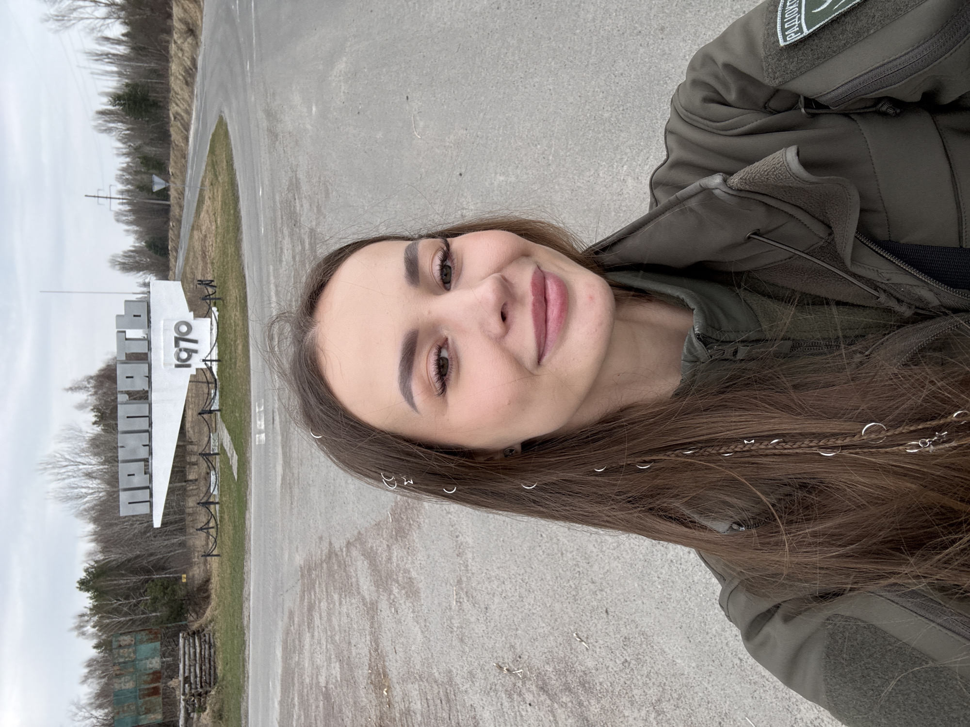 Woman visits Pryp'yat', Ukraine entrance and roadside areas