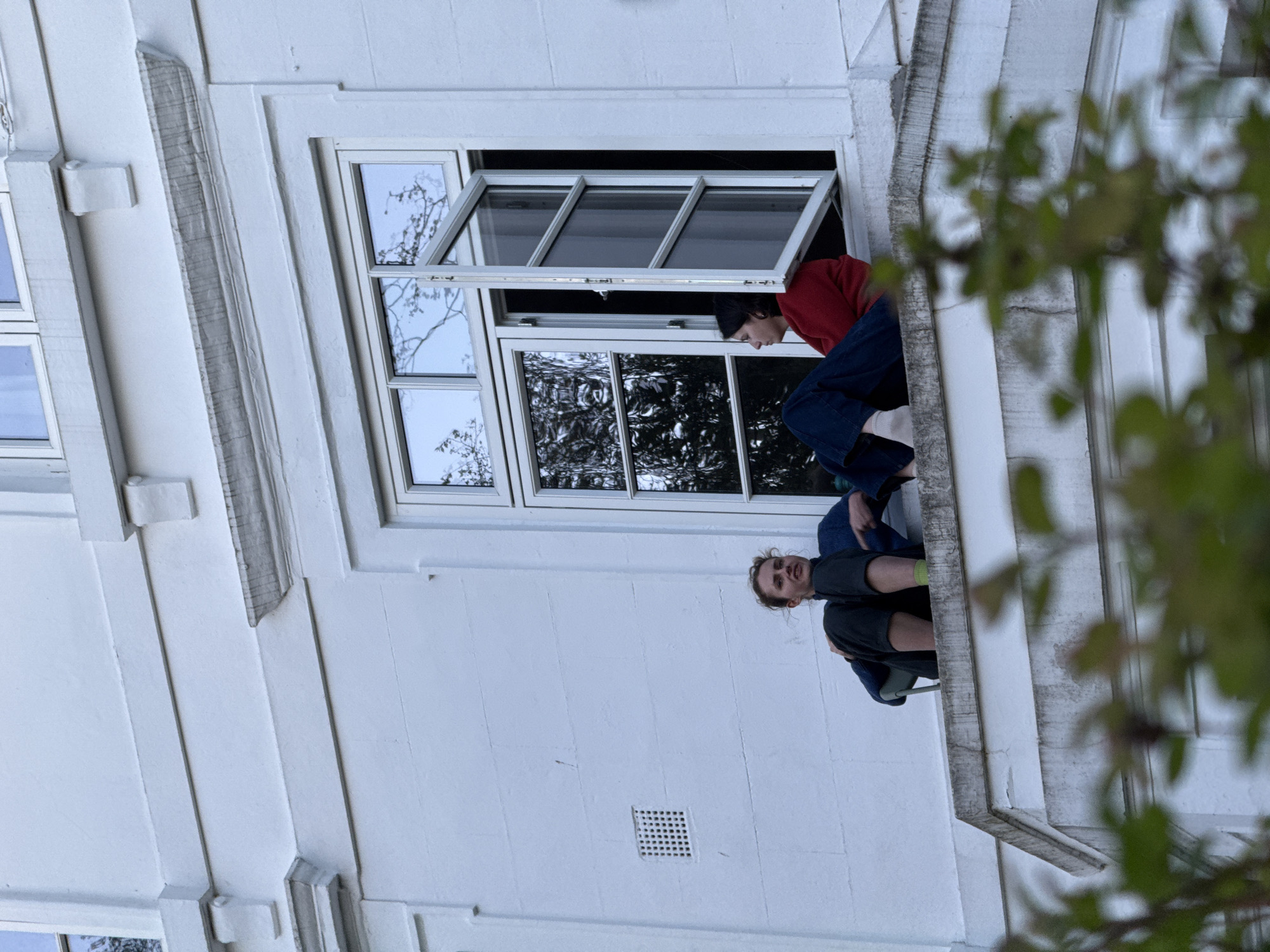 Two people spotted at London building window near academy