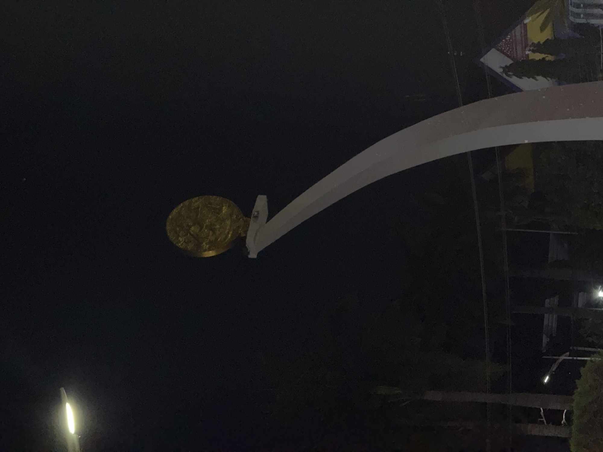 Nighttime traffic documented around Lhokseumawe monument roundabout