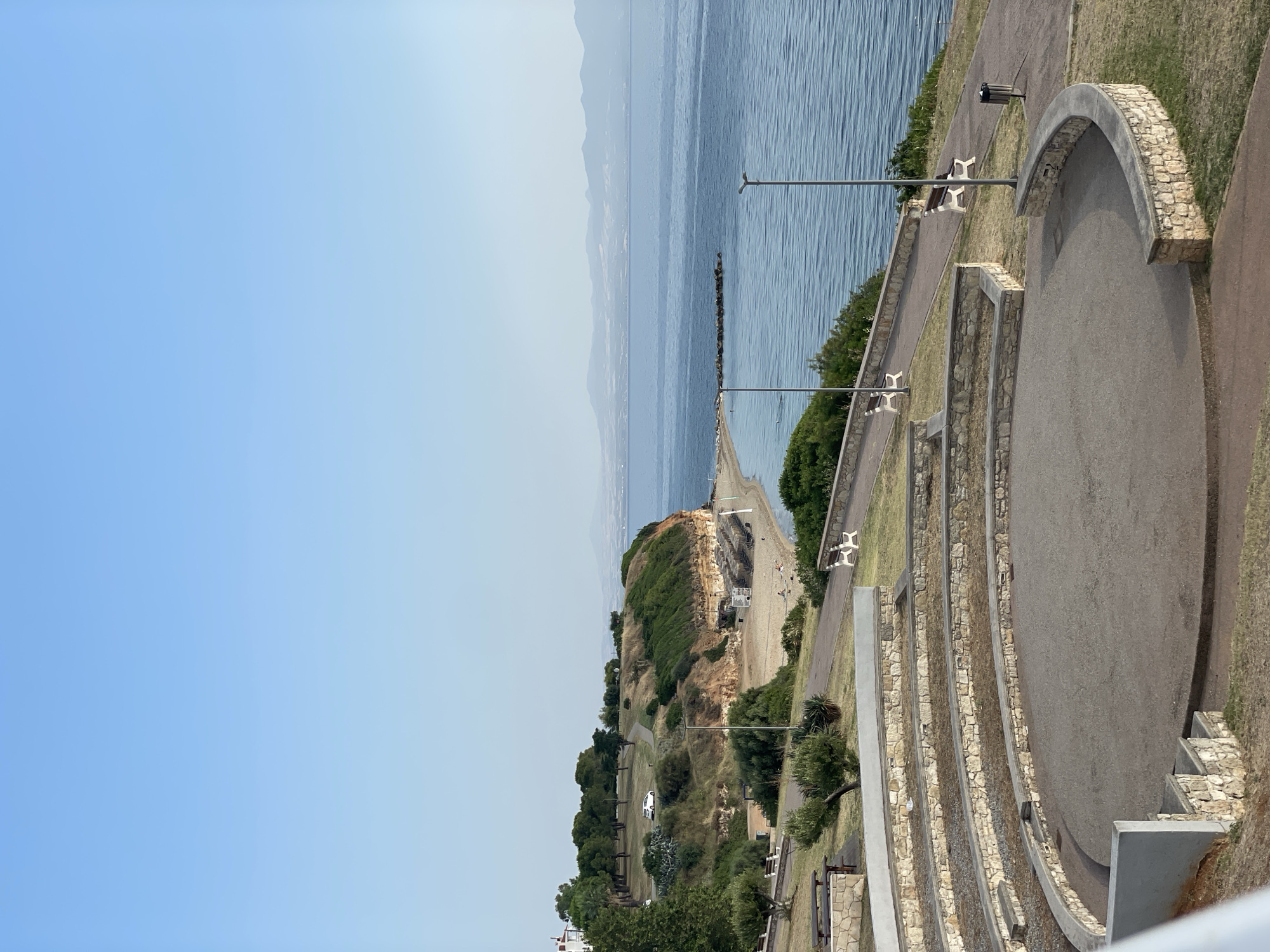 Kassandra coastline at dawn: amphitheater, trees, and calm water