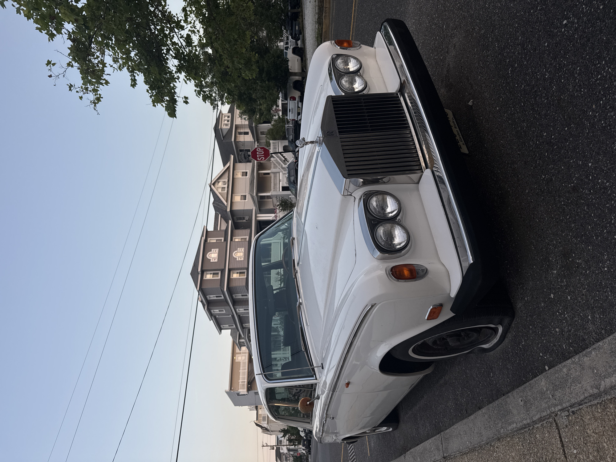 Rolls-Royce with a flat tire parked on an Ocean City street