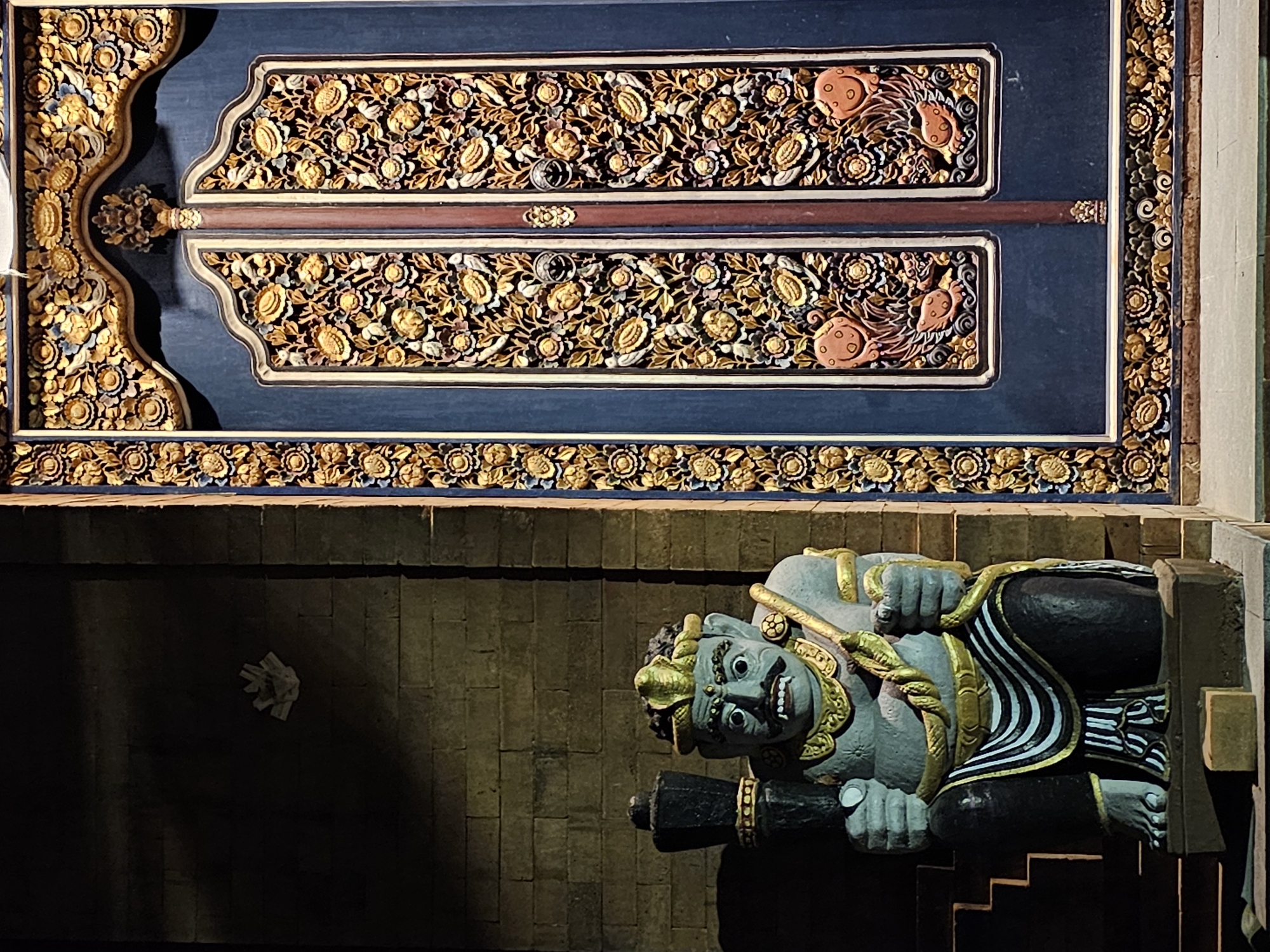 Temple architecture documented in nighttime Denpasar street scenes