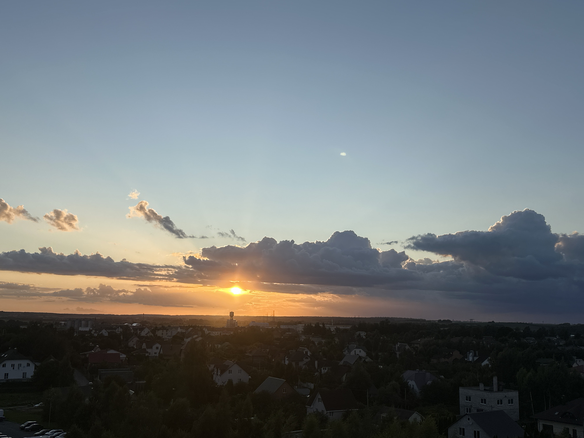 Dusk settles over a quiet Belarusian suburban neighborhood
