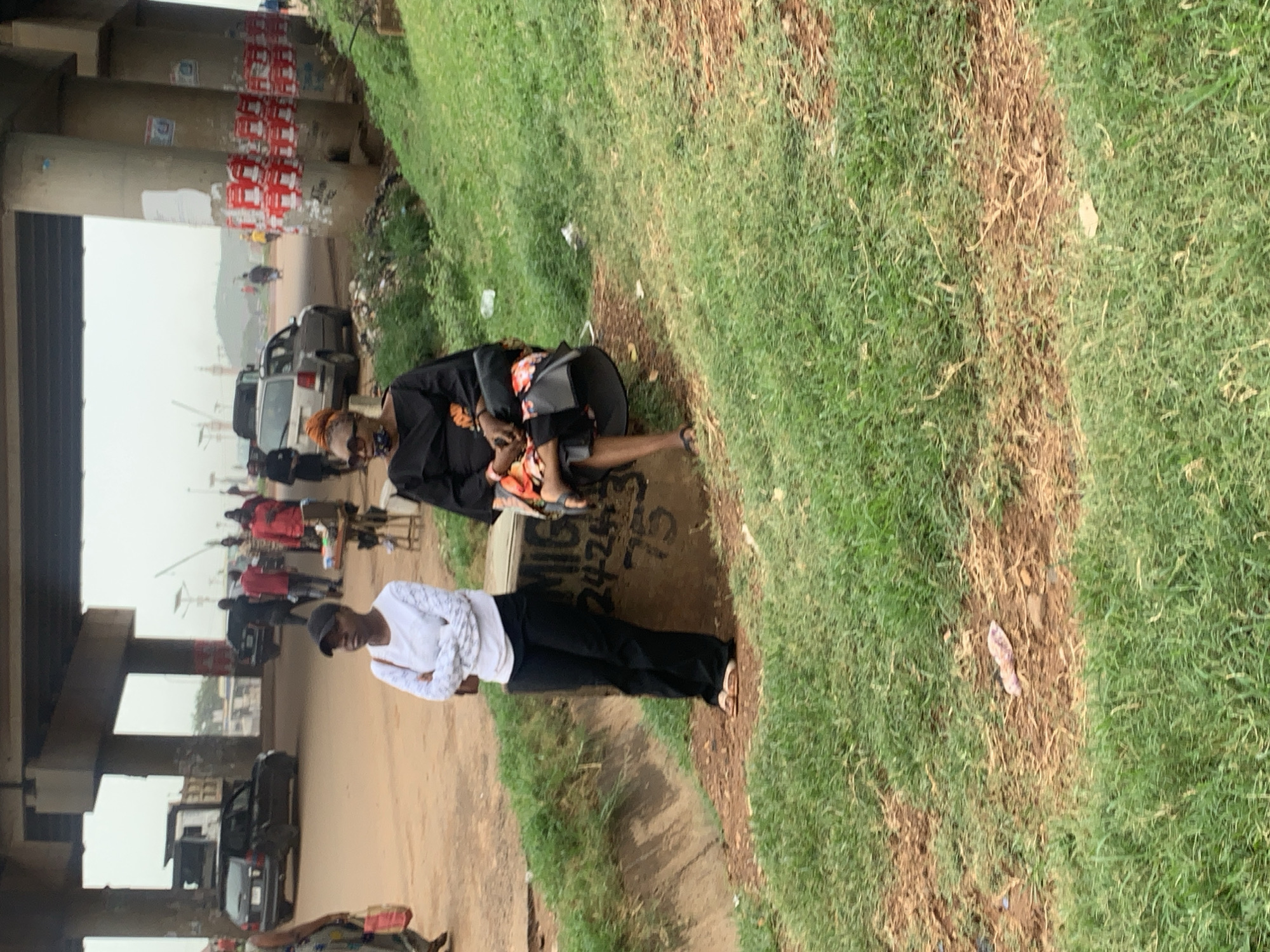 Roadside hustle and foot traffic under Nyanya overpass