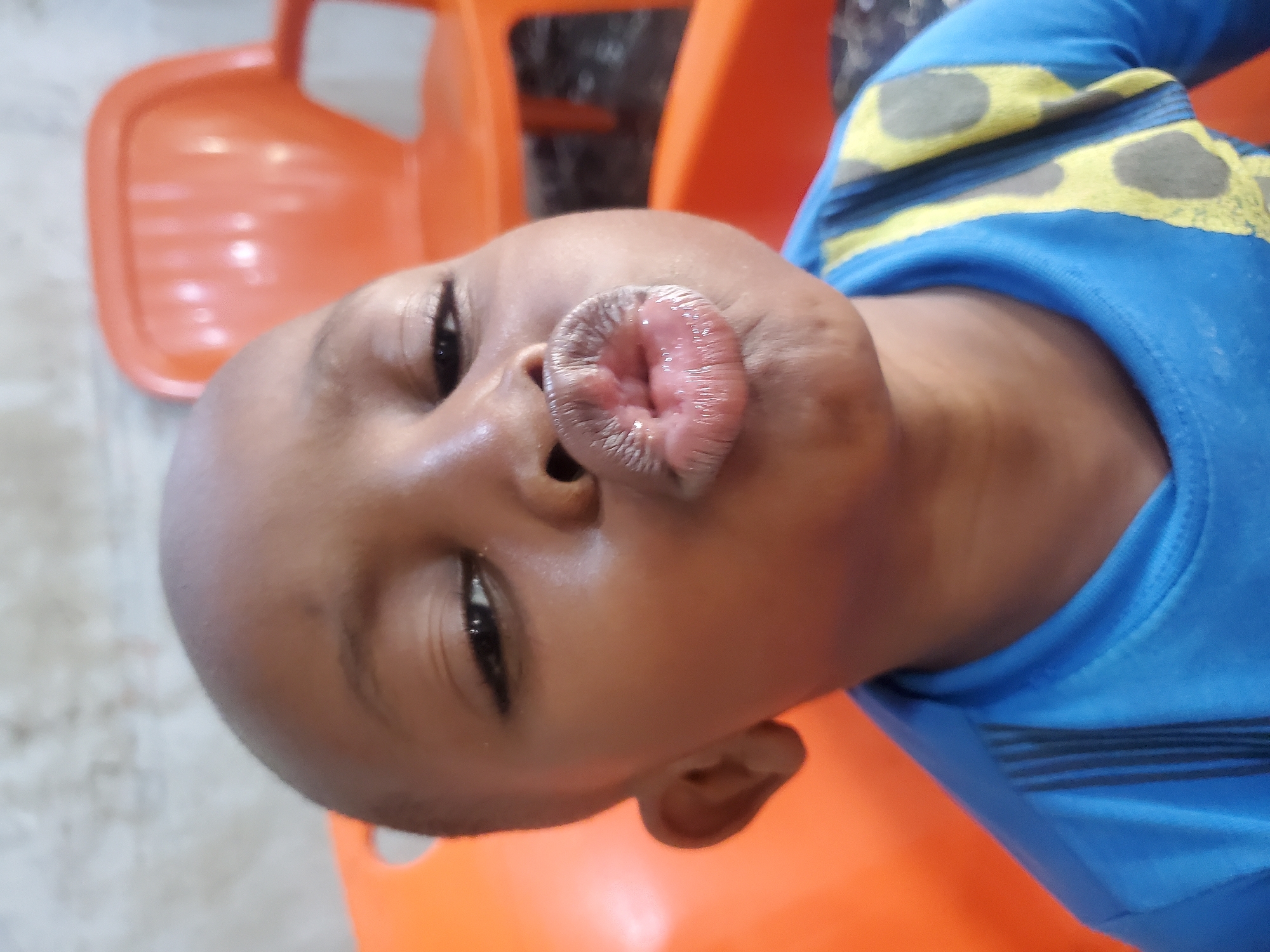 Playful close-up portraits of a child in Jos, Nigeria