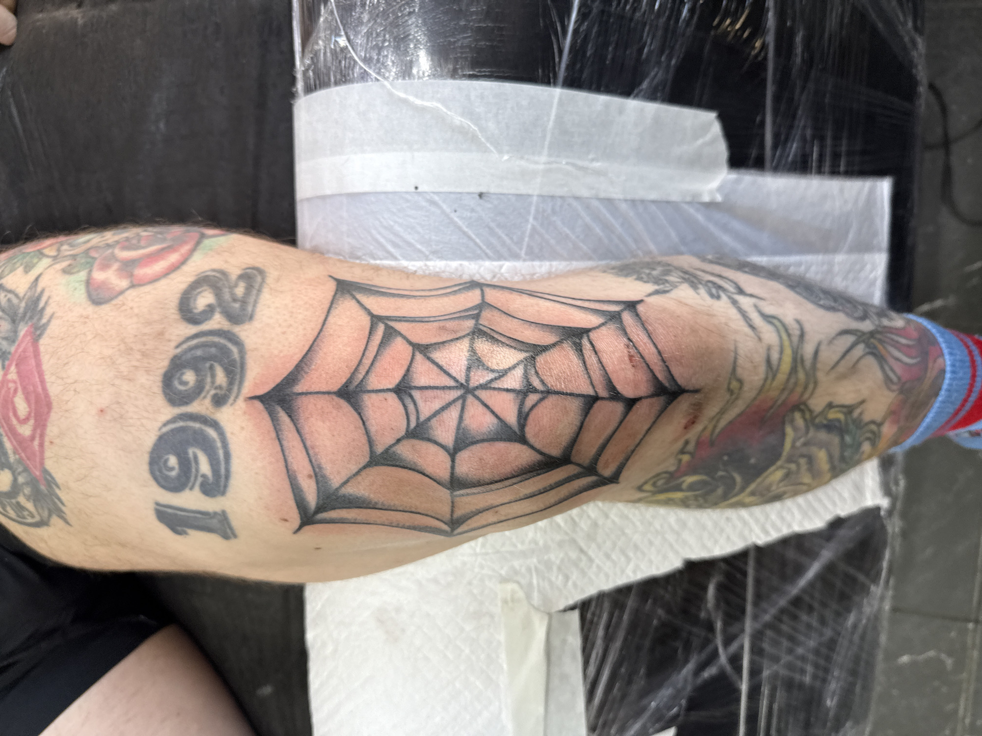 Tattooed arm with spiderweb design observed in Moscow