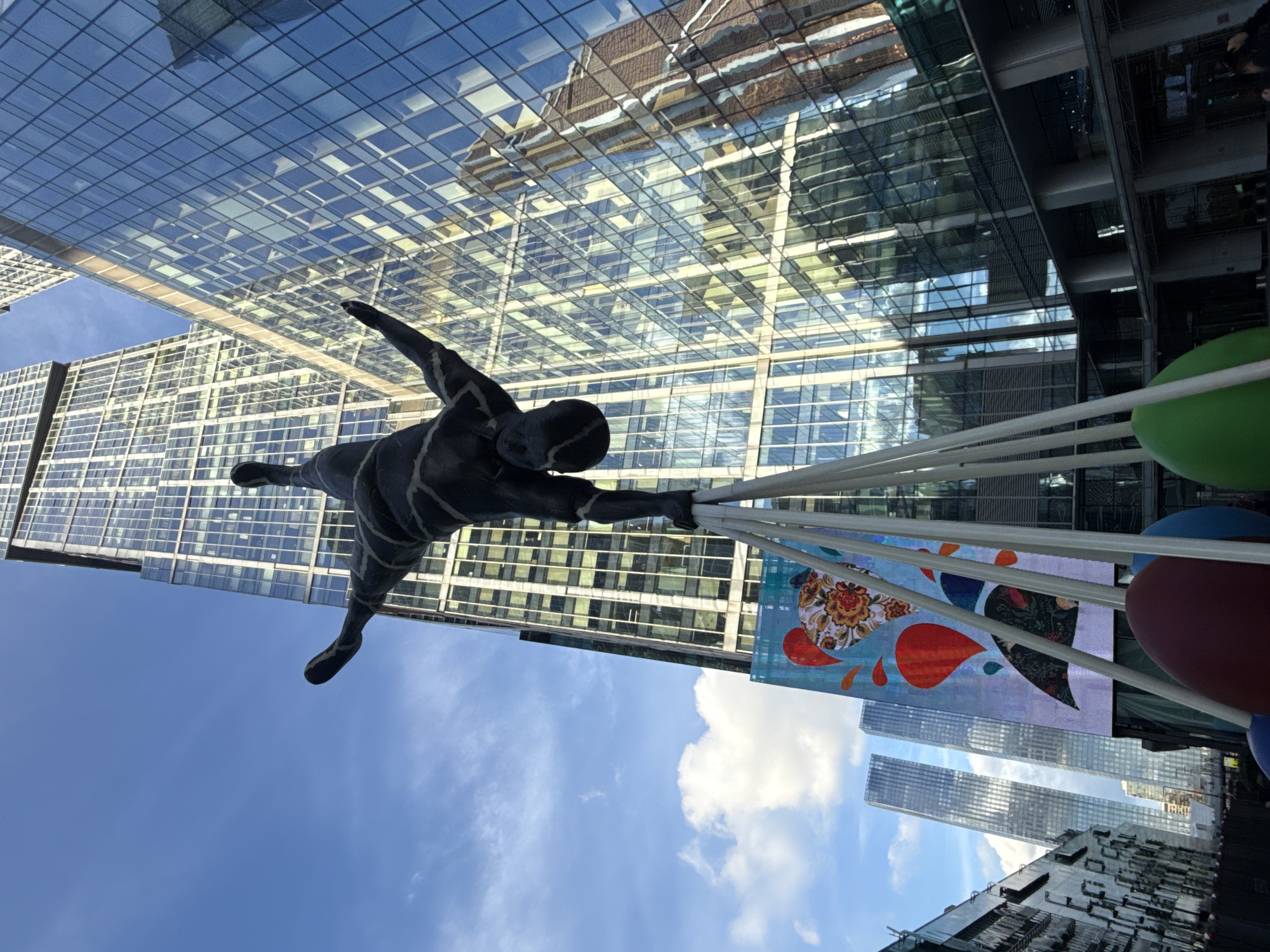 Glass towers and a handstand statue define Khimki's modern plaza