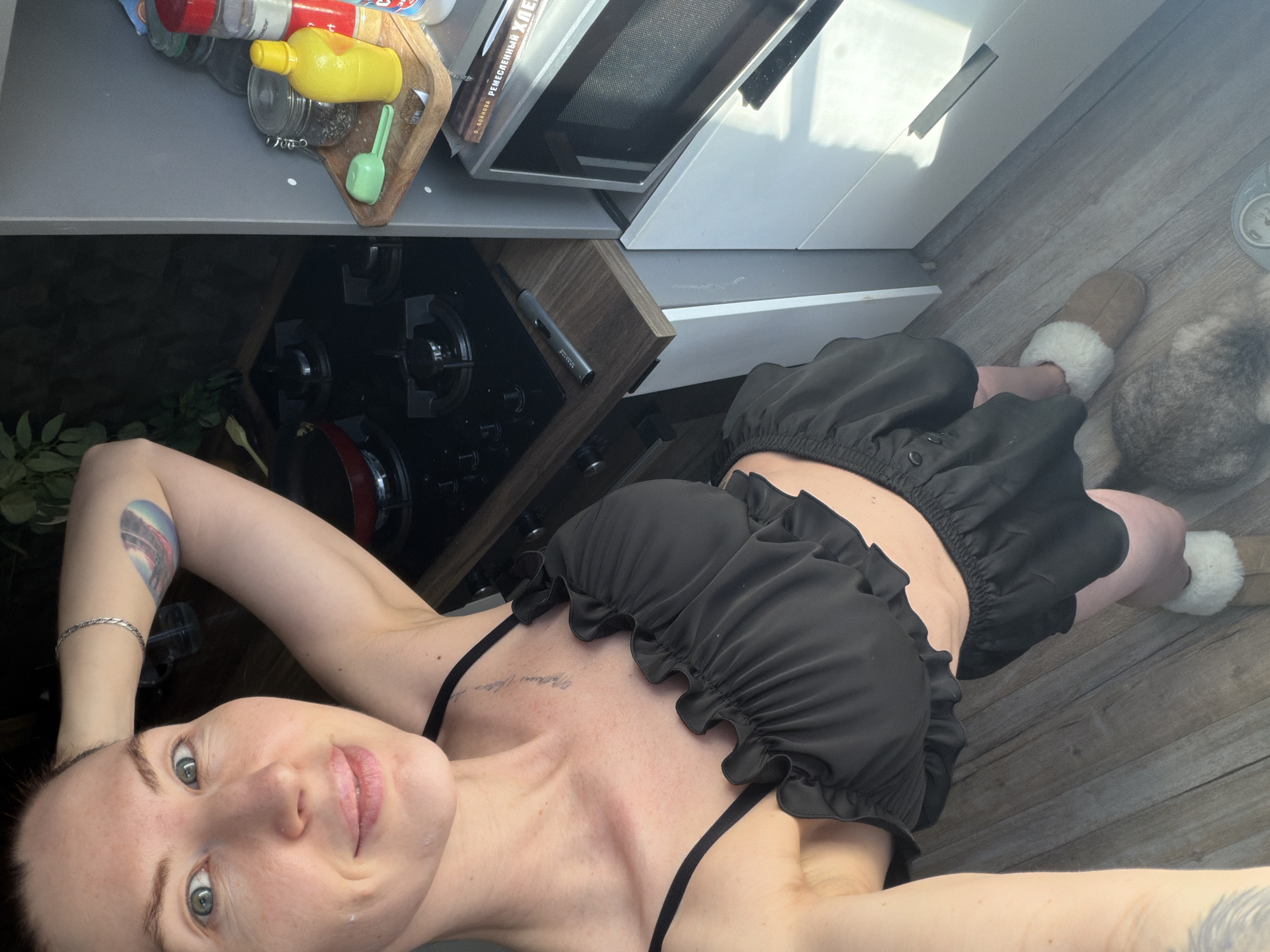 Woman takes kitchen floor selfie in Perm, Russia