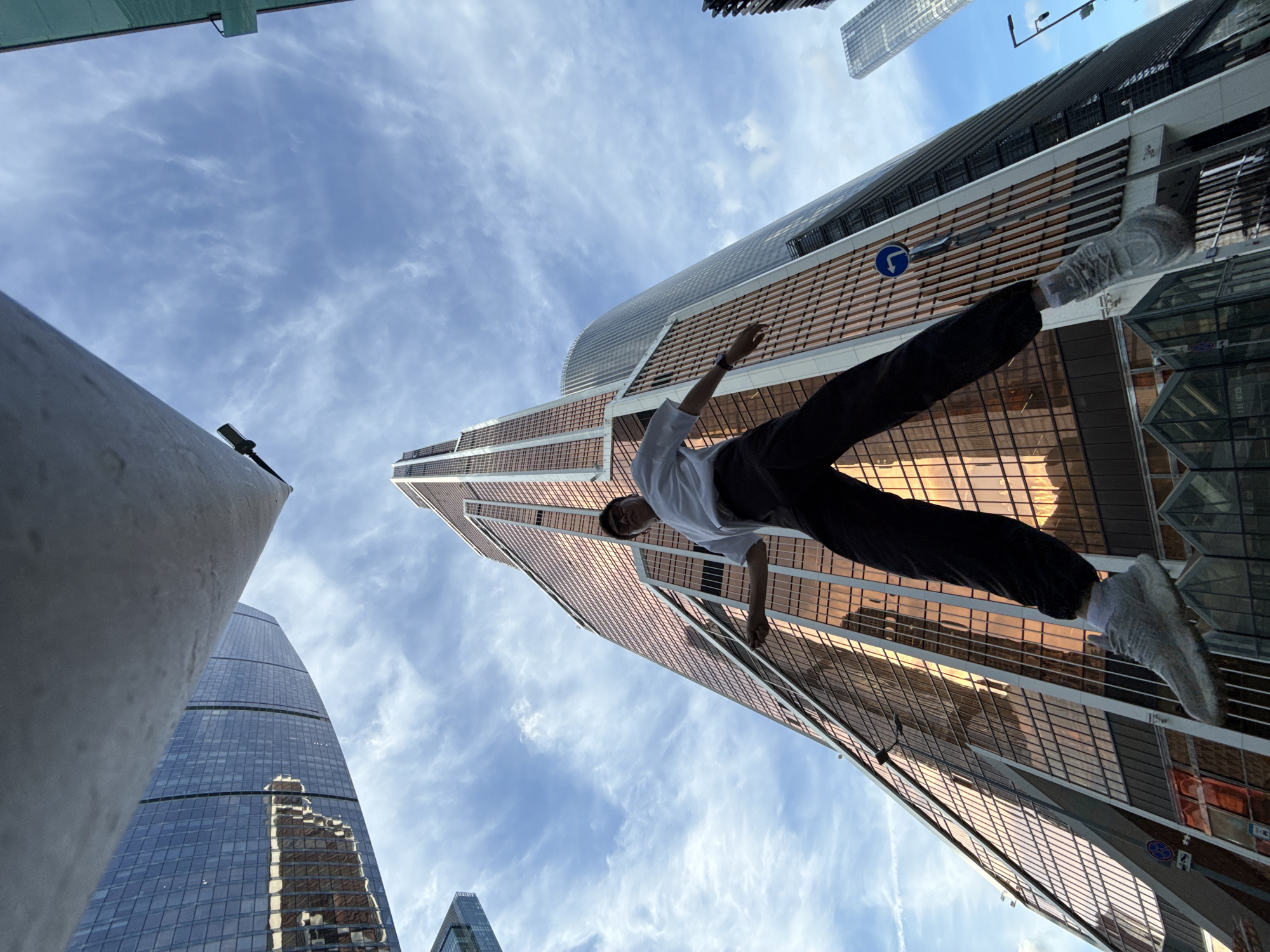 Jumps and gatherings in a Khimki plaza below glass towers