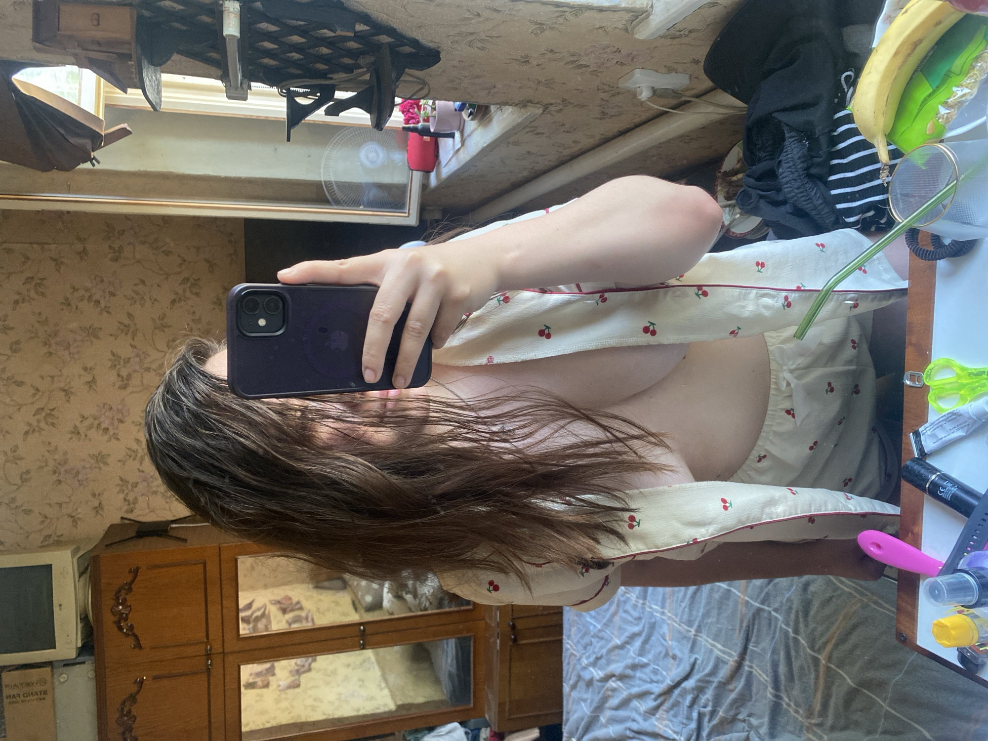 Mirror selfies in a floral-wallpapered bedroom, two looks