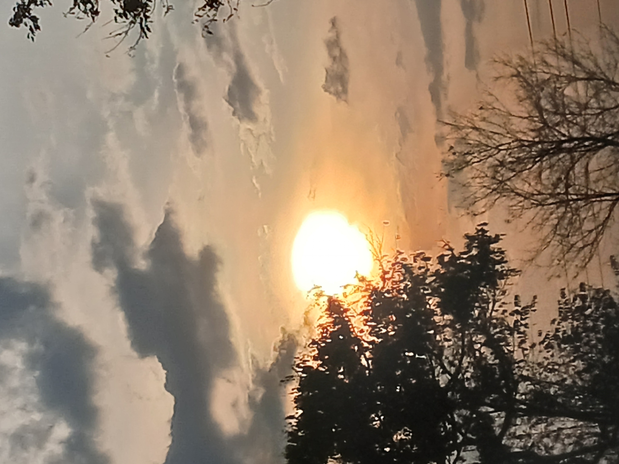 Dusk landscape captured in Orupe, Venezuela shows sun behind clouds