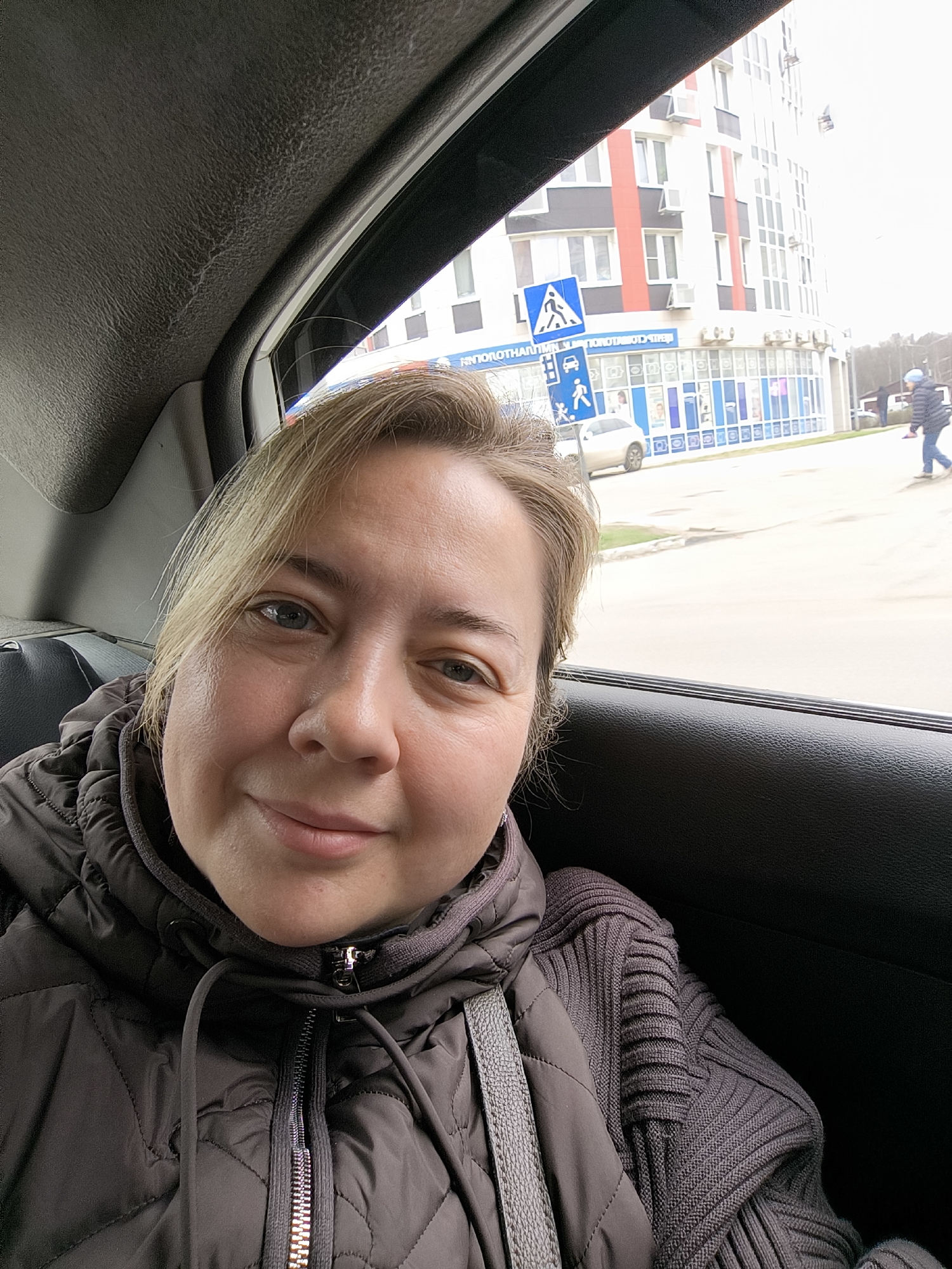Woman travels as passenger in car through Khimki