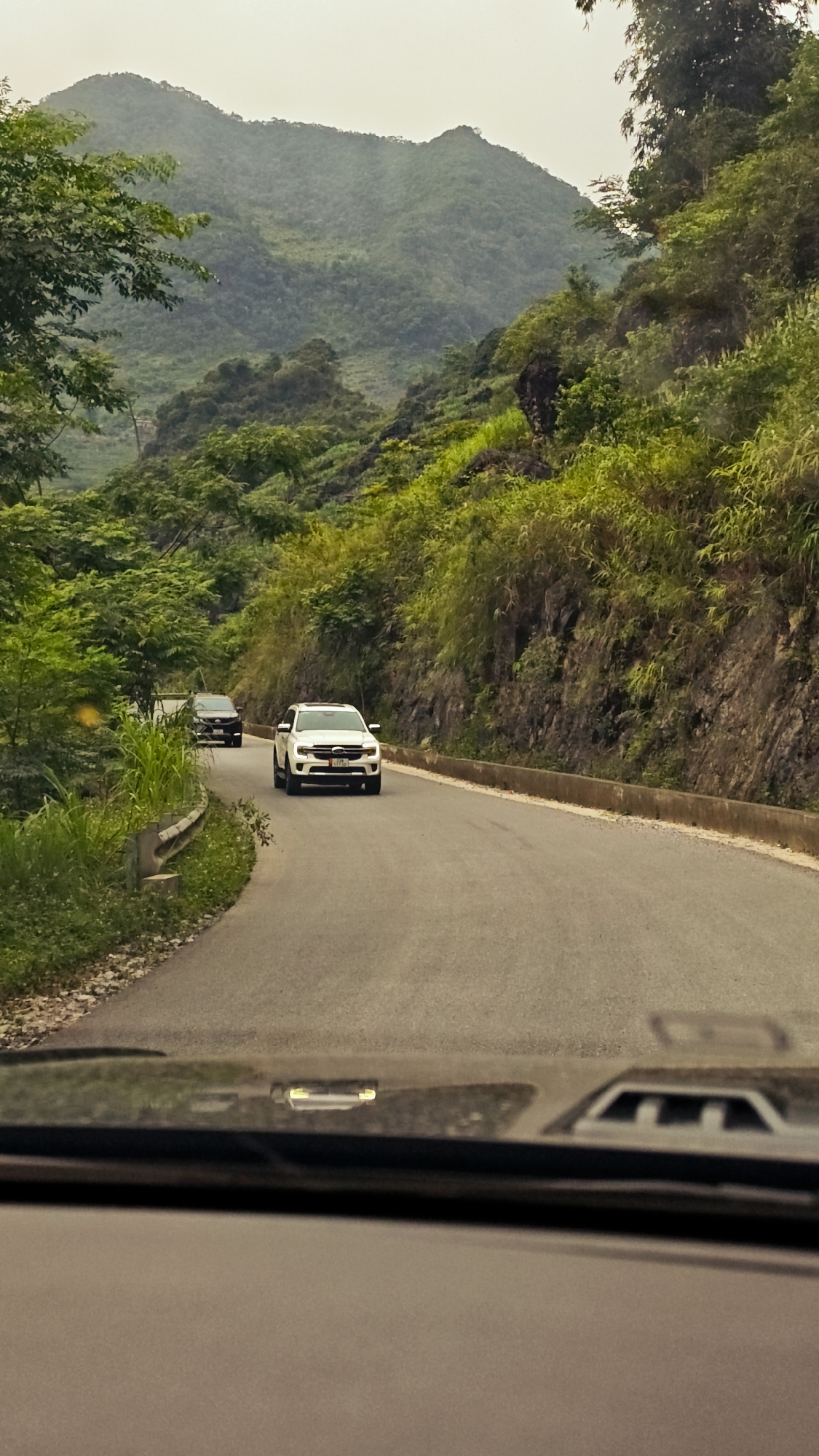 Vehicle traffic observed on rural road in Vietnam commune