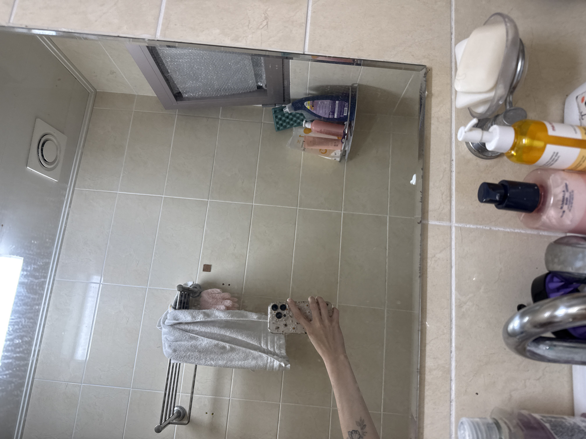 Bathroom selfies in Gwangju, playful angles and floral details