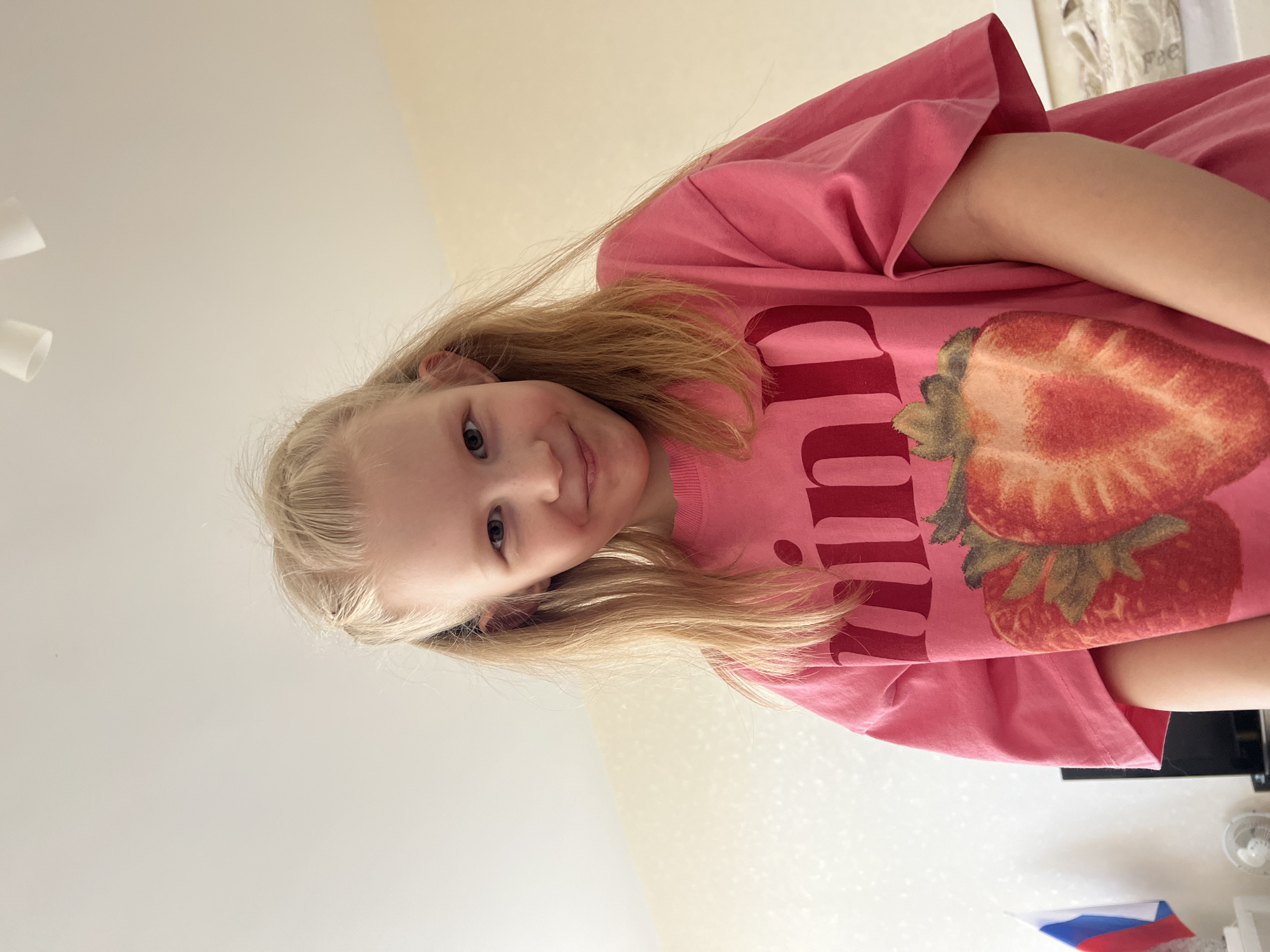 Girl in strawberry shirt photographed indoors in Yekaterinburg