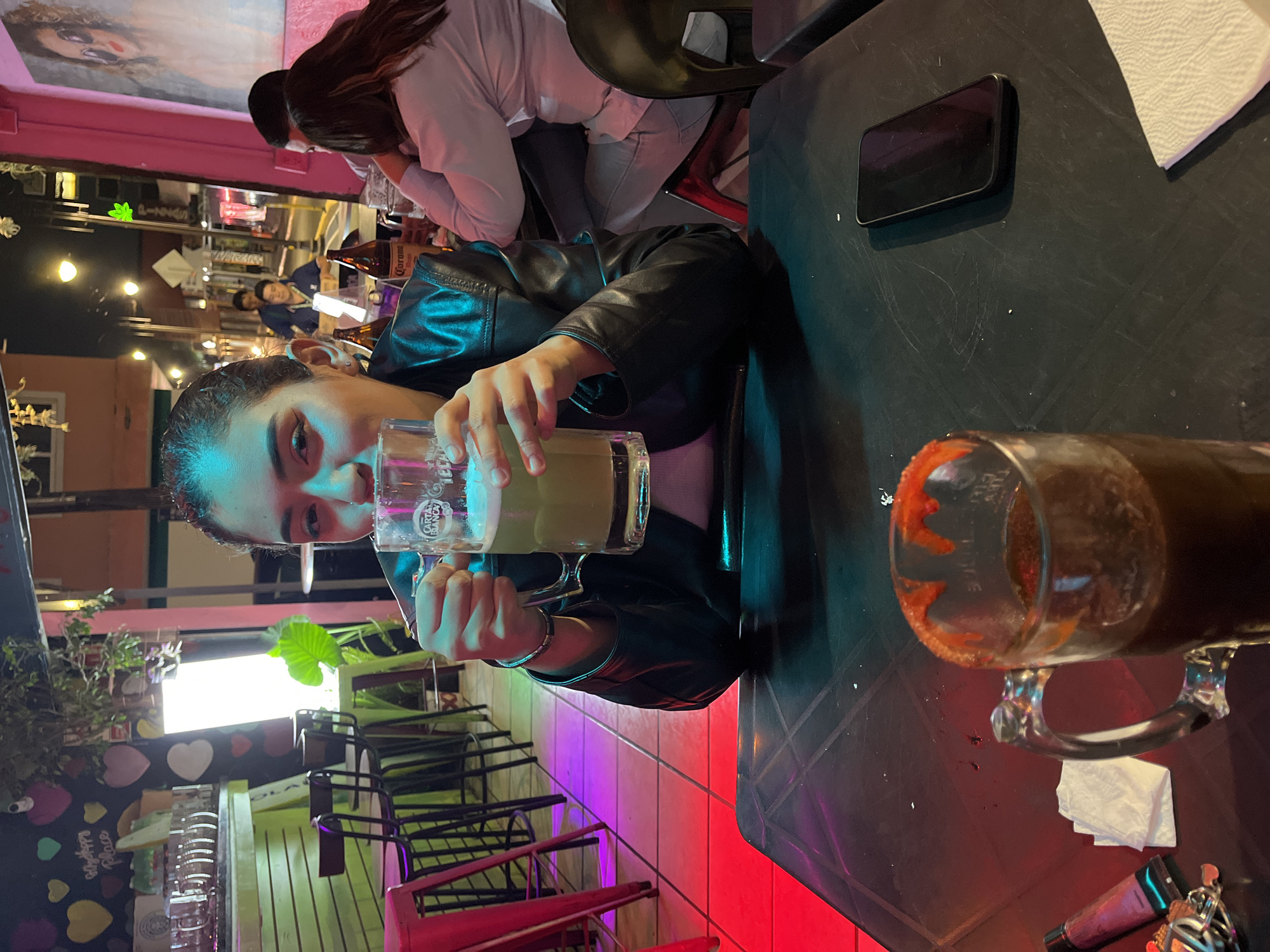 Woman enjoys beer at San Andrés Cholula establishment