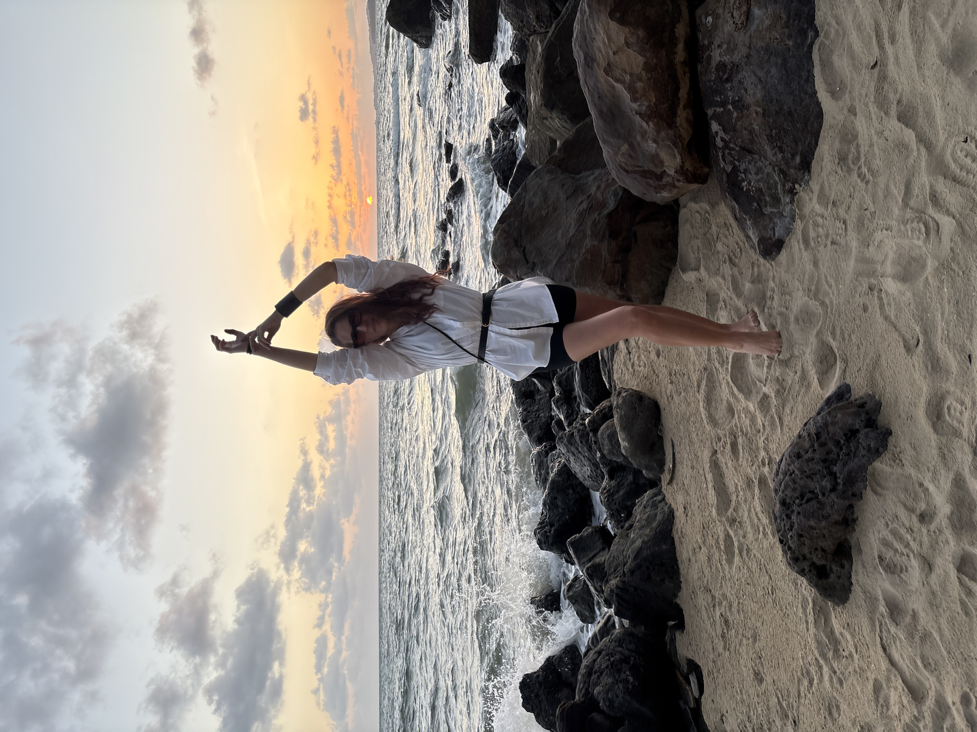 Sunset selfies and seascape shots on a rocky beach