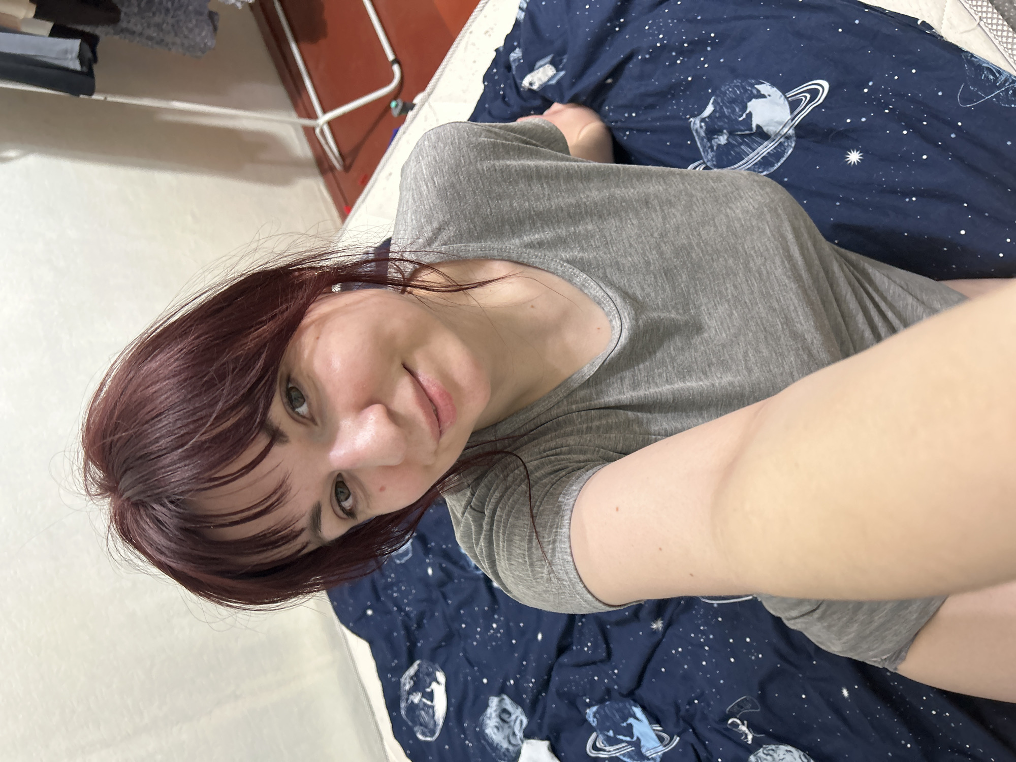 Woman resting on bed in Russian home