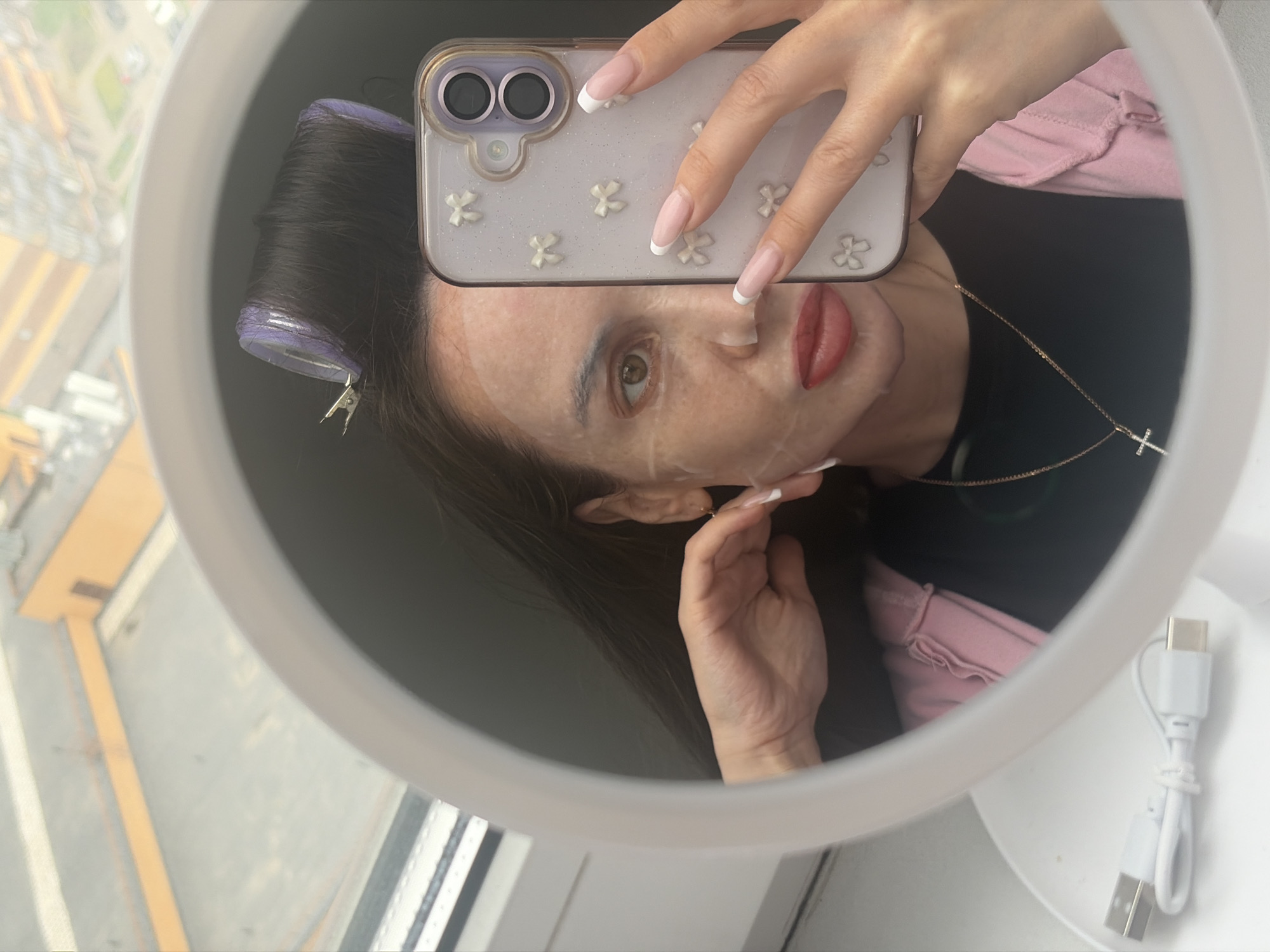 Woman documents beauty routine with selfie in Russian apartment