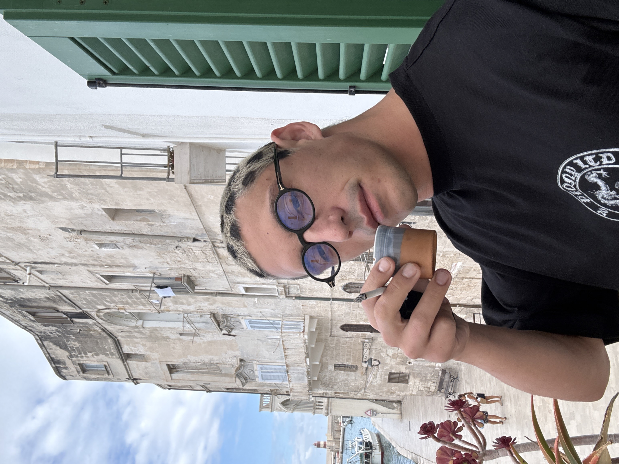 Person observed viewing Monopoli harbor from balcony overlook