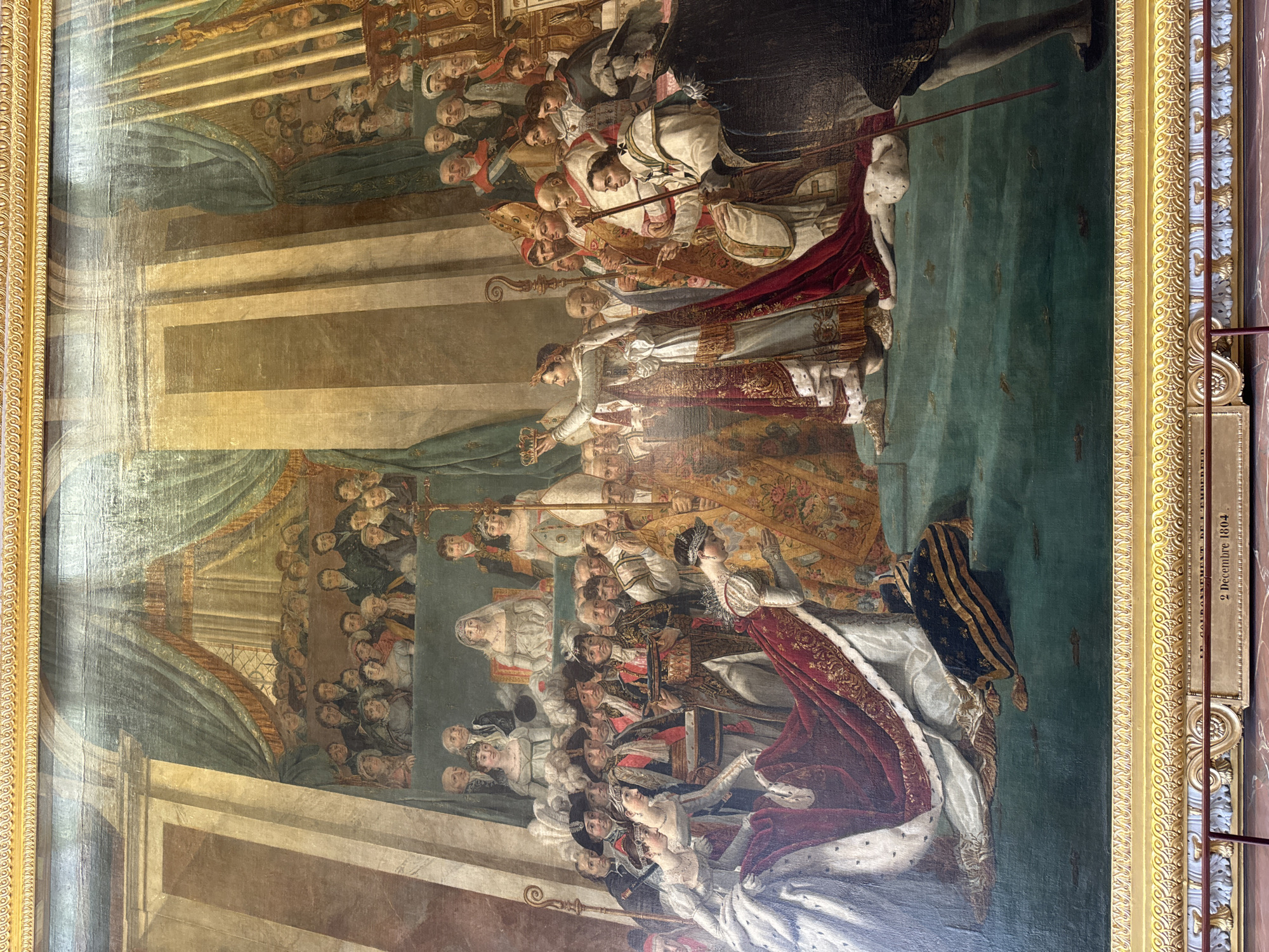 Tourist photographs Napoleon coronation painting at Versailles Palace