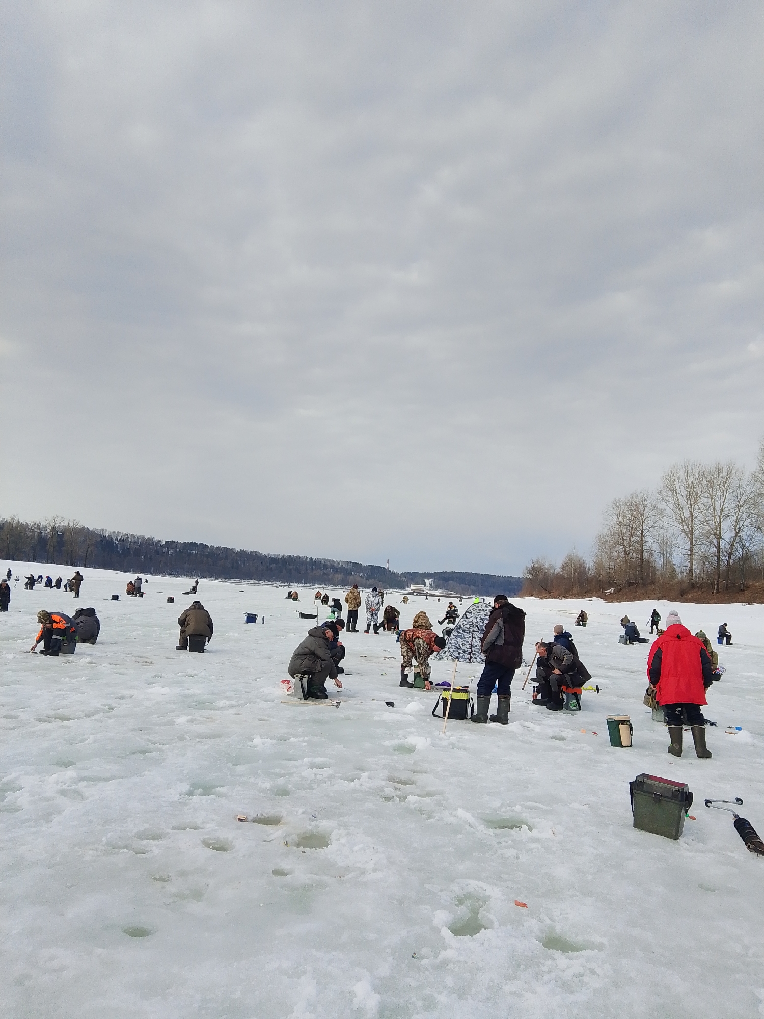 Ice fishing activity observed on frozen water in Russia