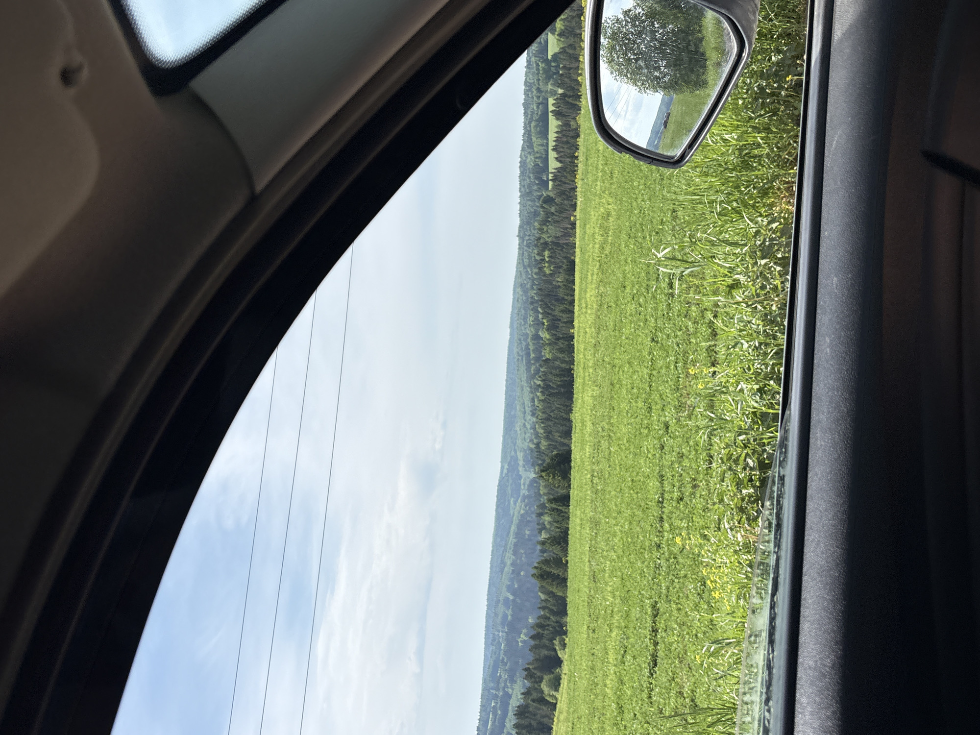 Young woman documents rural car journey near Khokhlovka, Russia