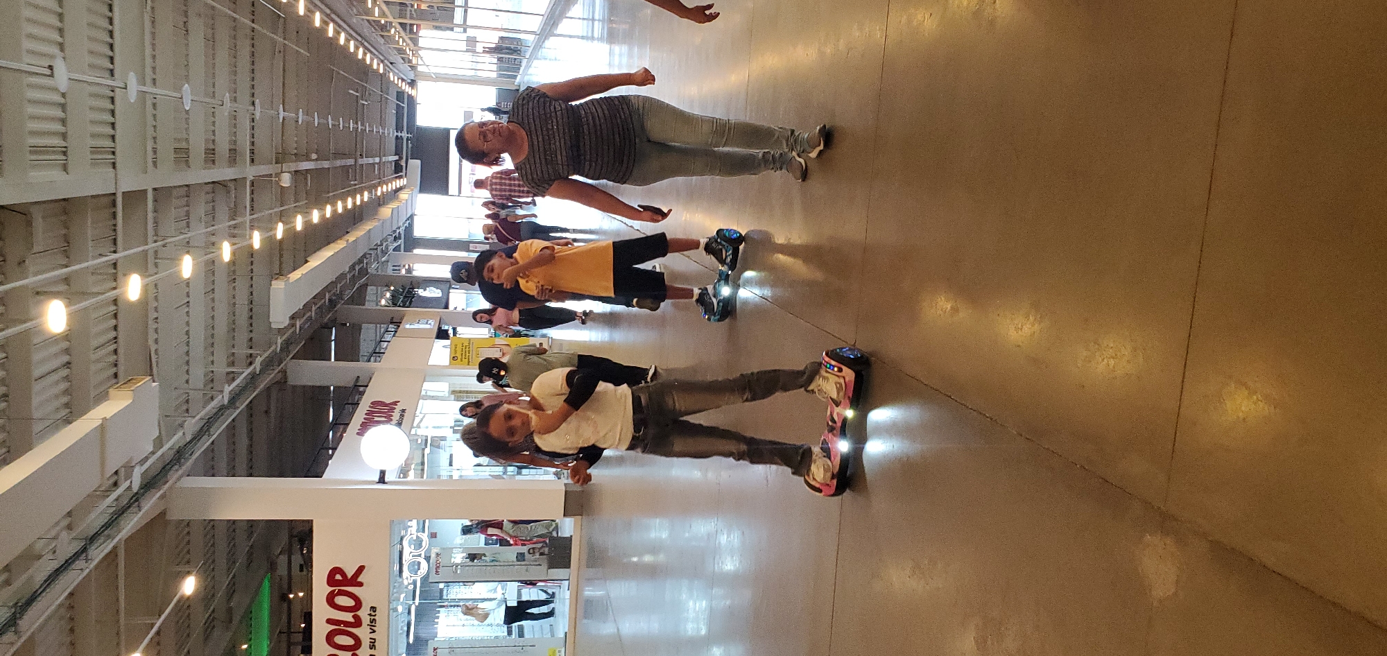 Three ride scooters inside Cabudare shopping center