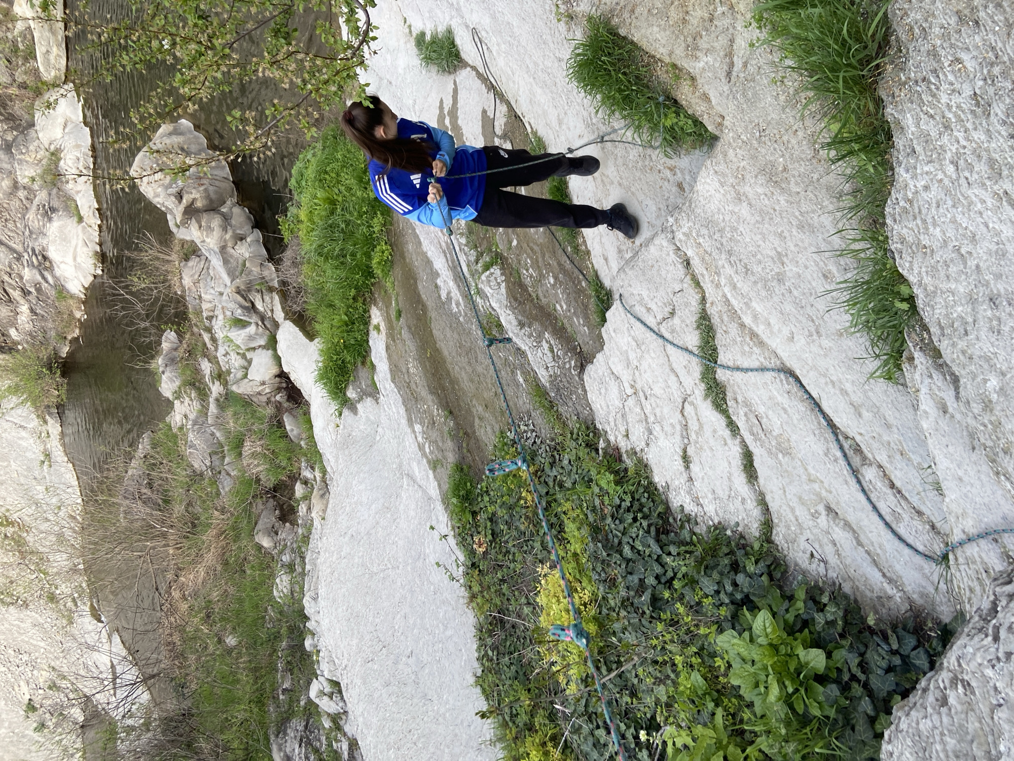 Rock climber scales cliffs near Kapinovo Waterfall, Bulgaria