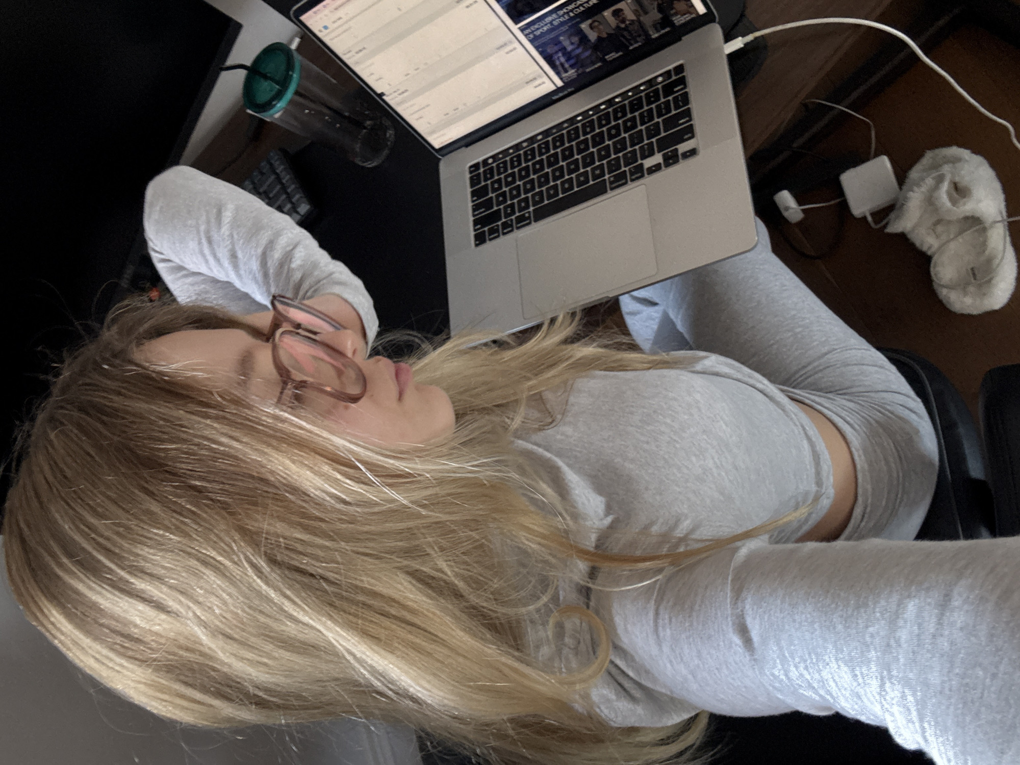 Woman works on laptop in office chair, Mexico City