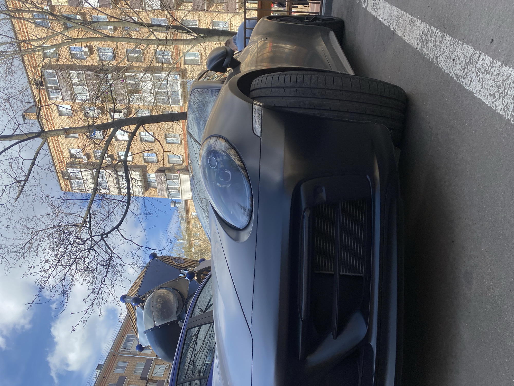 Dark Porsche spotted parked in Moscow parking area