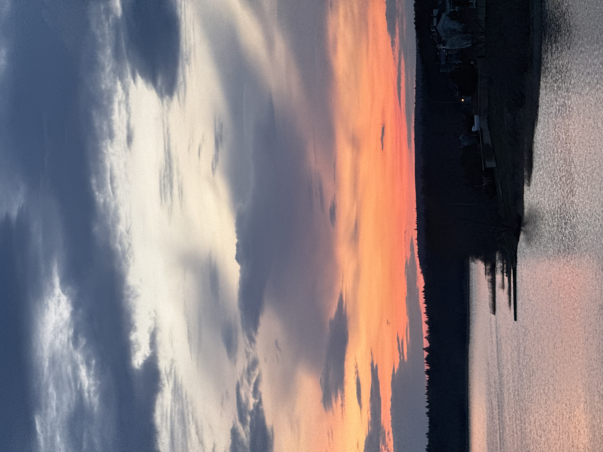 Dramatic sunset captured over water in Votkinsk, Russia
